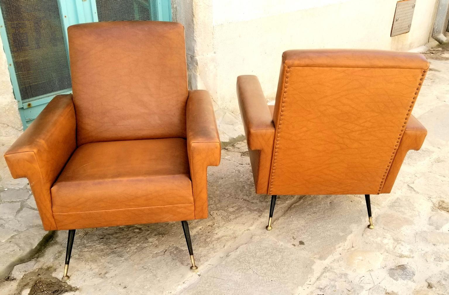 Italian pair of chairs, period 1950 s original vinyl upholstery metal and brass legs. Great Italian design and comfortable seating.
   