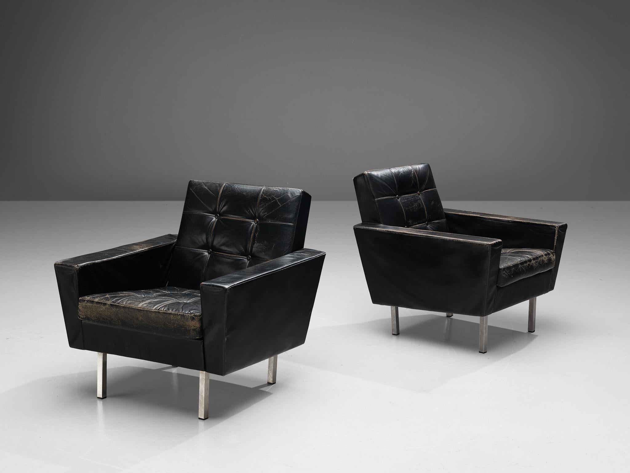Pair of lounge chairs, leatherette, metal, Italy, 1970s 

This sleek looking pair of Italian lounge chairs is characterized by a solid construction, that is noticeable in the body of the seating area and the geometrical shaped armrests, underling