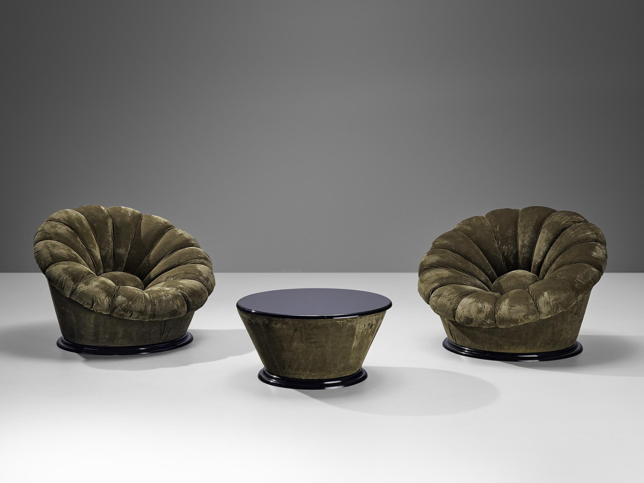 Pair of lounge chairs with coffee table, velvet, lacquered wood, plastic, Italy, 1970s

Eccentric lounge set of Italian origin. The lounge chairs resemble a flower by means of the inward-facing tufted lines and the round centre. The whole unit is
