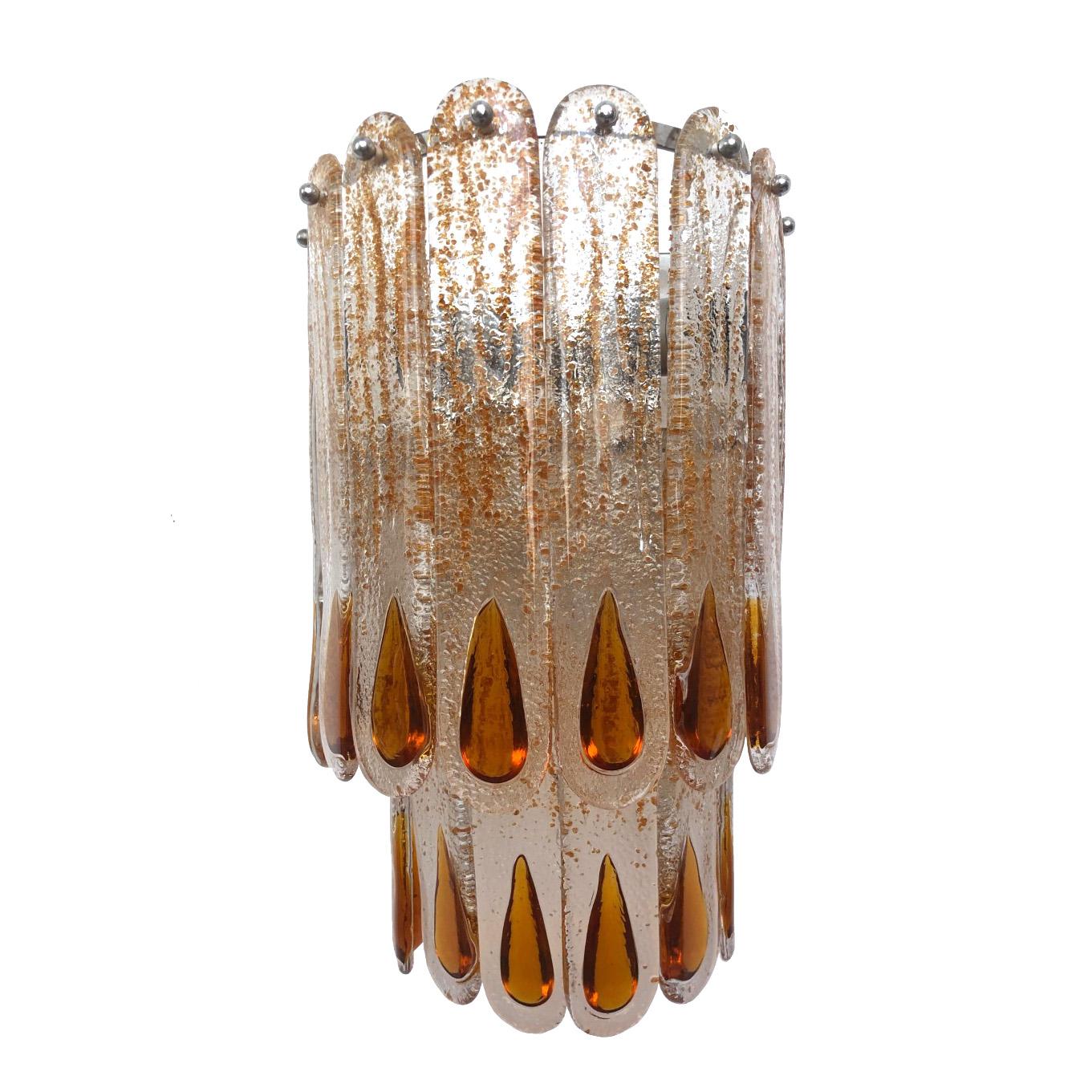 Marvelous and huge pair of Italian amber Murano glass wall sconces from 1970s.
These sconces were made during the 1970s in Italy for the Venice Company “Mazzega”.
Each wall sconce is composed by 14 units of Murano glasses (H 11.81 in. 30 cm x W