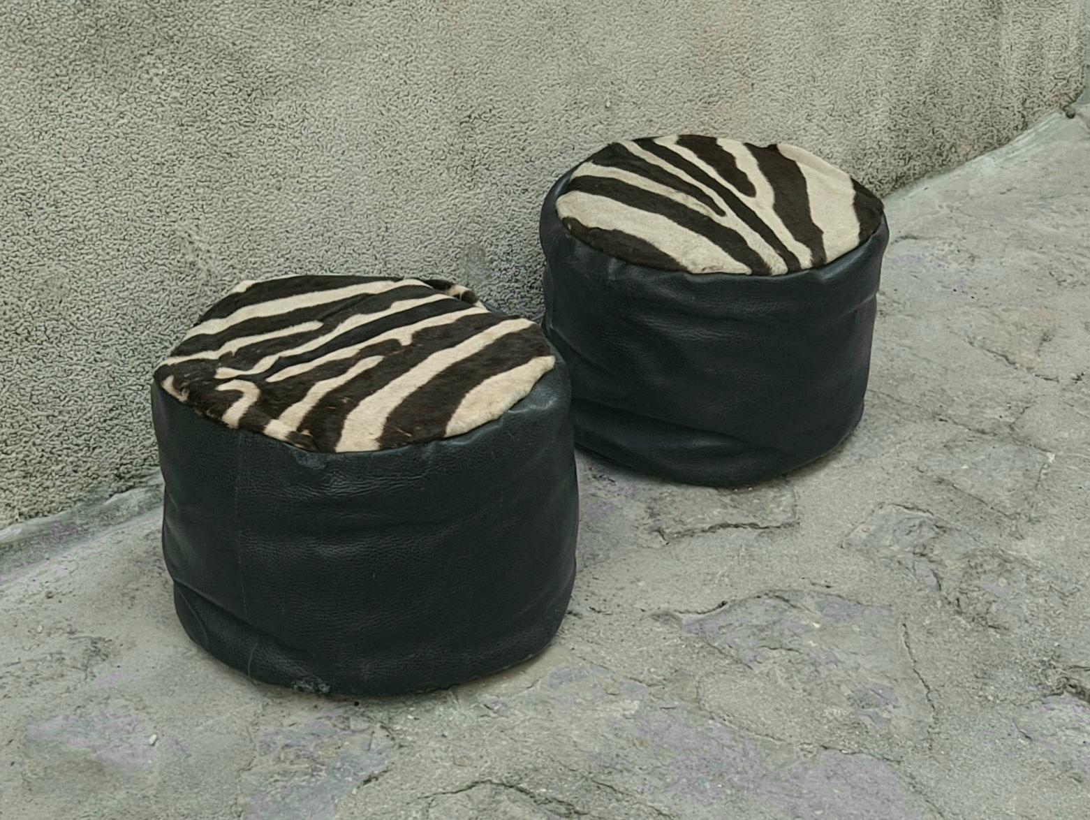 Italian mid century zebra pouf ottomans are hand stitched and made of the original Zebra hide and leather.