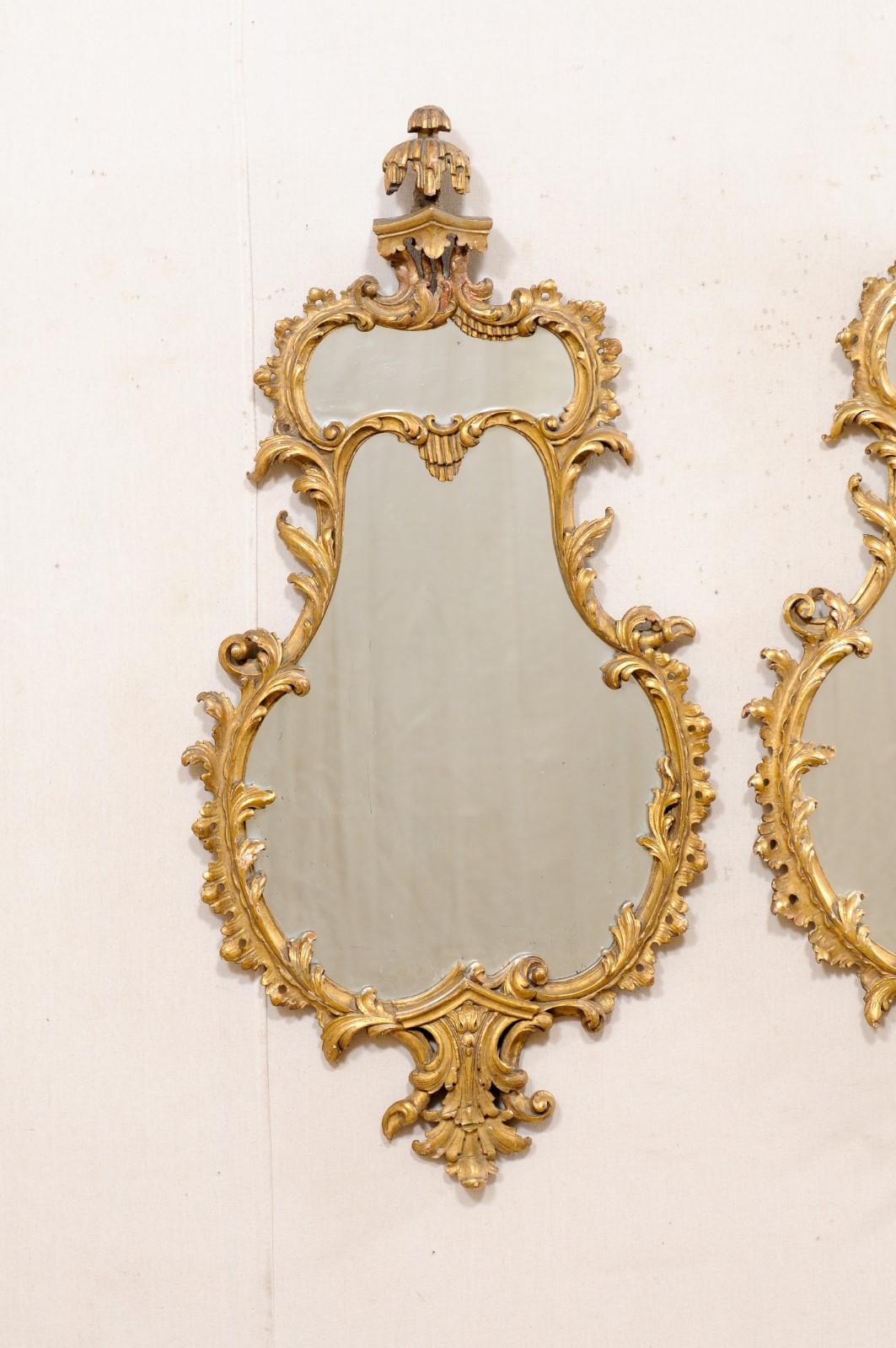 20th Century Italian Pair of Shapely Gilt Wood Wall Mirrors, Carved in Rococo Style, Mid 20th For Sale