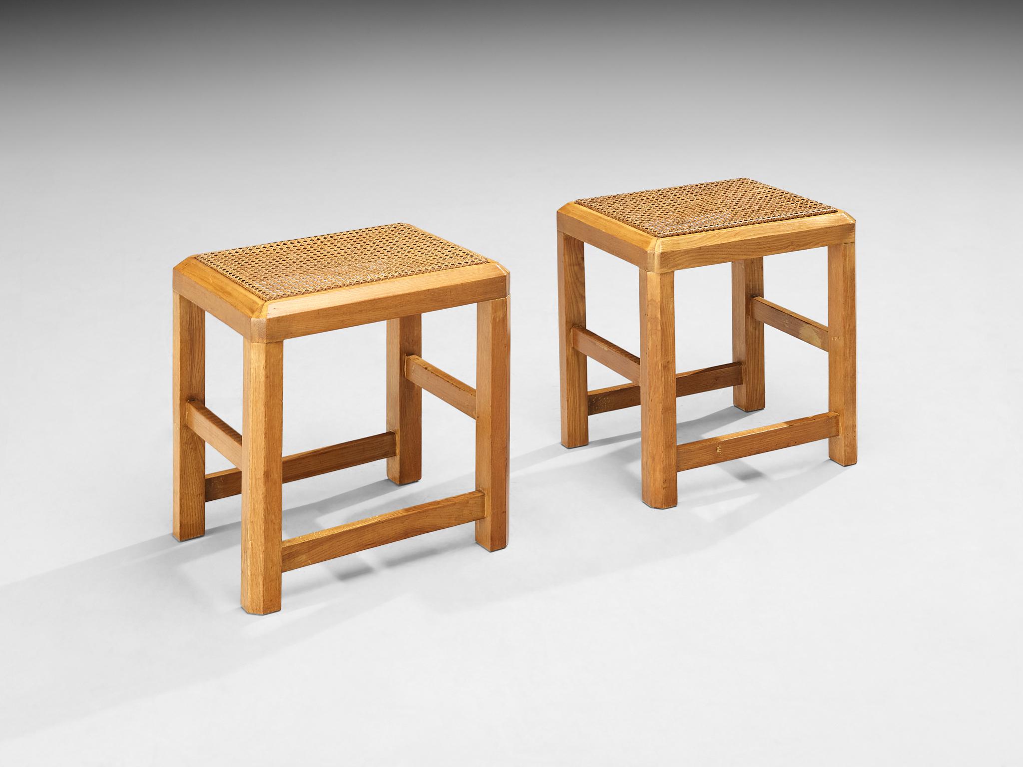 Pair of stools, cane, beech, Italy, 1970s

Simple and geometric shapes, free from ornamentation mark the design. The wooden frame is rectangular with bevelled edges that smooth the overall sturdy appearance. The seats are covered in octagonal mesh
