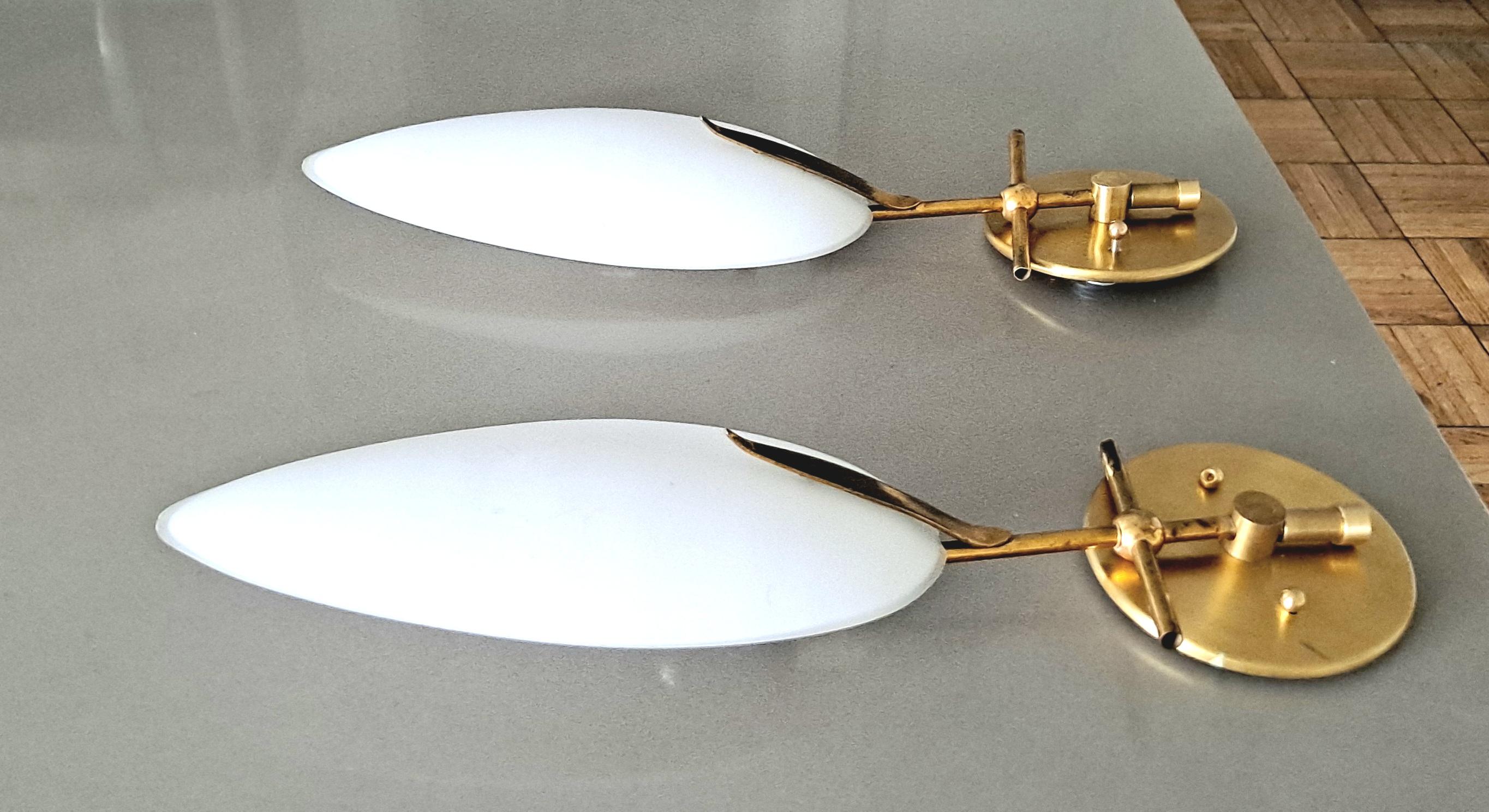 Italian pair of wall sconces .Wall lights are in the manner of Stilonovo .
Brass base with Opaline glass in original condition from the period .