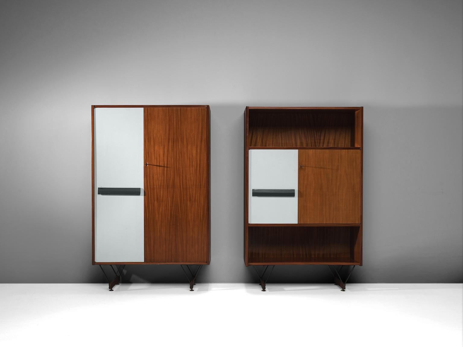 Set of 2 cabinets, walnut, plywood and steel, Italy, 1960s.

This set of wooden cabinets feature the design aesthetics of 1960s in Italy. The refined metal legs give the heavy cabinets a floating character. The outside of the cabinets are made of