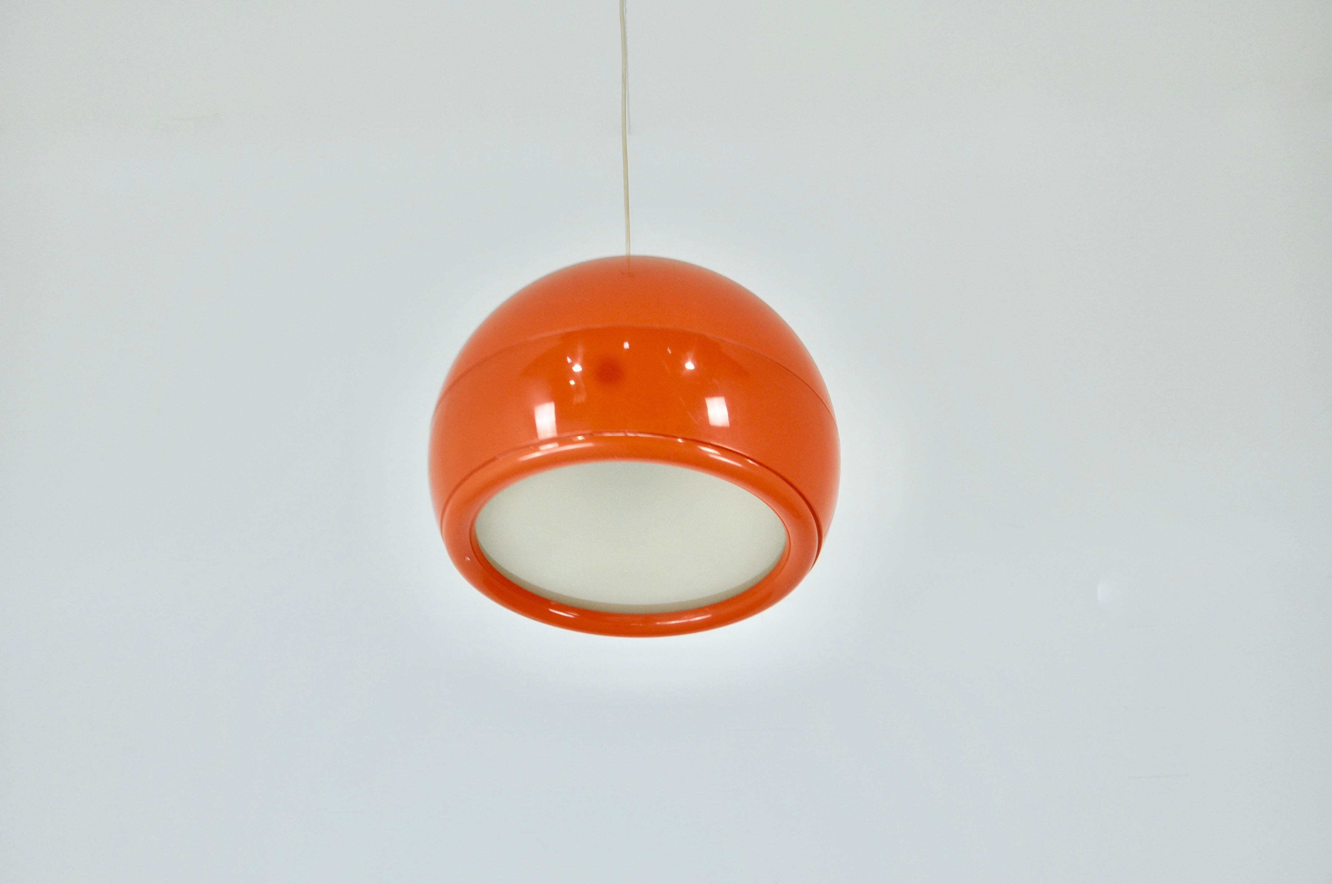 Plastic chandelier in orange color. Wear due to time and age of the lamp.