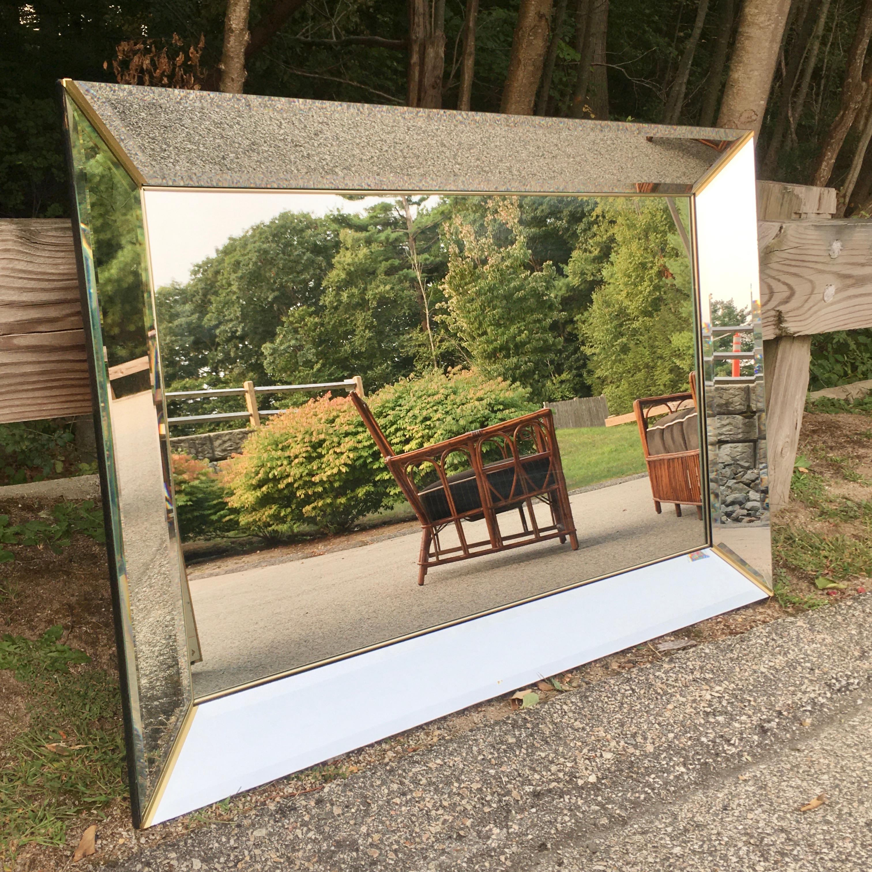 A Minimalist variation of the Classic Venetian scalloped and etched mirrors from the period, without all the fuss. The large midcentury Italian rectangular mirror is extended to the slanted frame with 4.5 inch panels of beveled mirror on four sides.