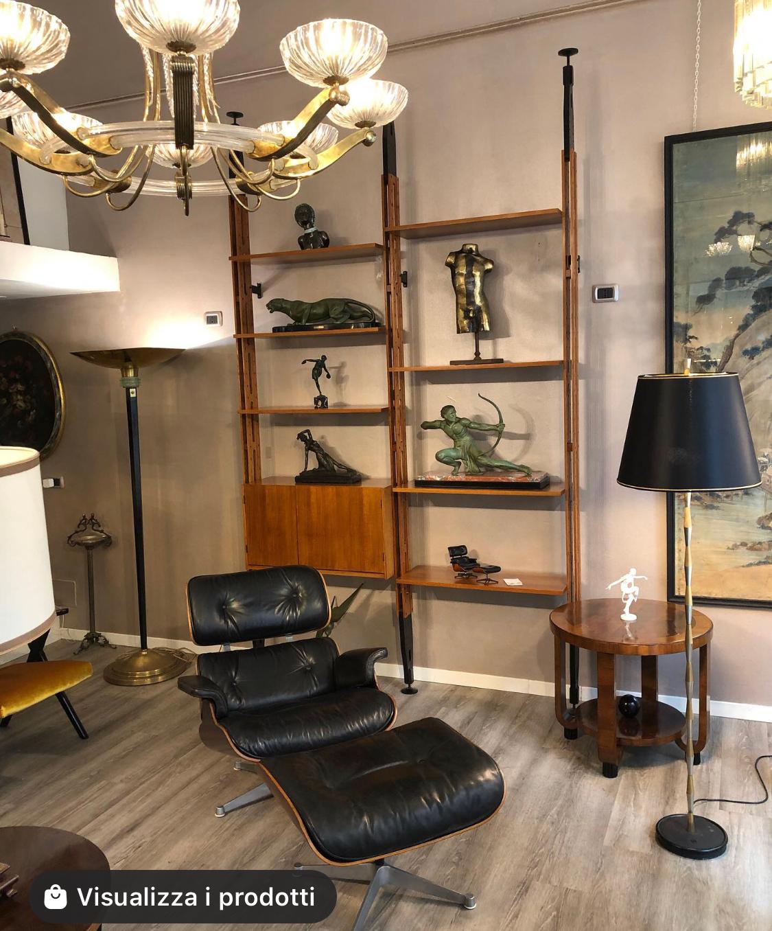 Bookcase created in the 1962 by Paolo Tilche for Arform. Wooden uprights, black painted wood terminals, adjustable black plastic terminals. 6 shelves and a container. Brass screws and details. Height is adjustable between 270 and 300 cm if you need