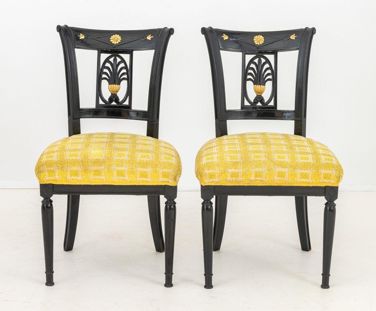 Pair of Italian Parcel Gilt Ebonized Side Chairs, carved back splat, yellow upholstered seats on four fluted legs. 36