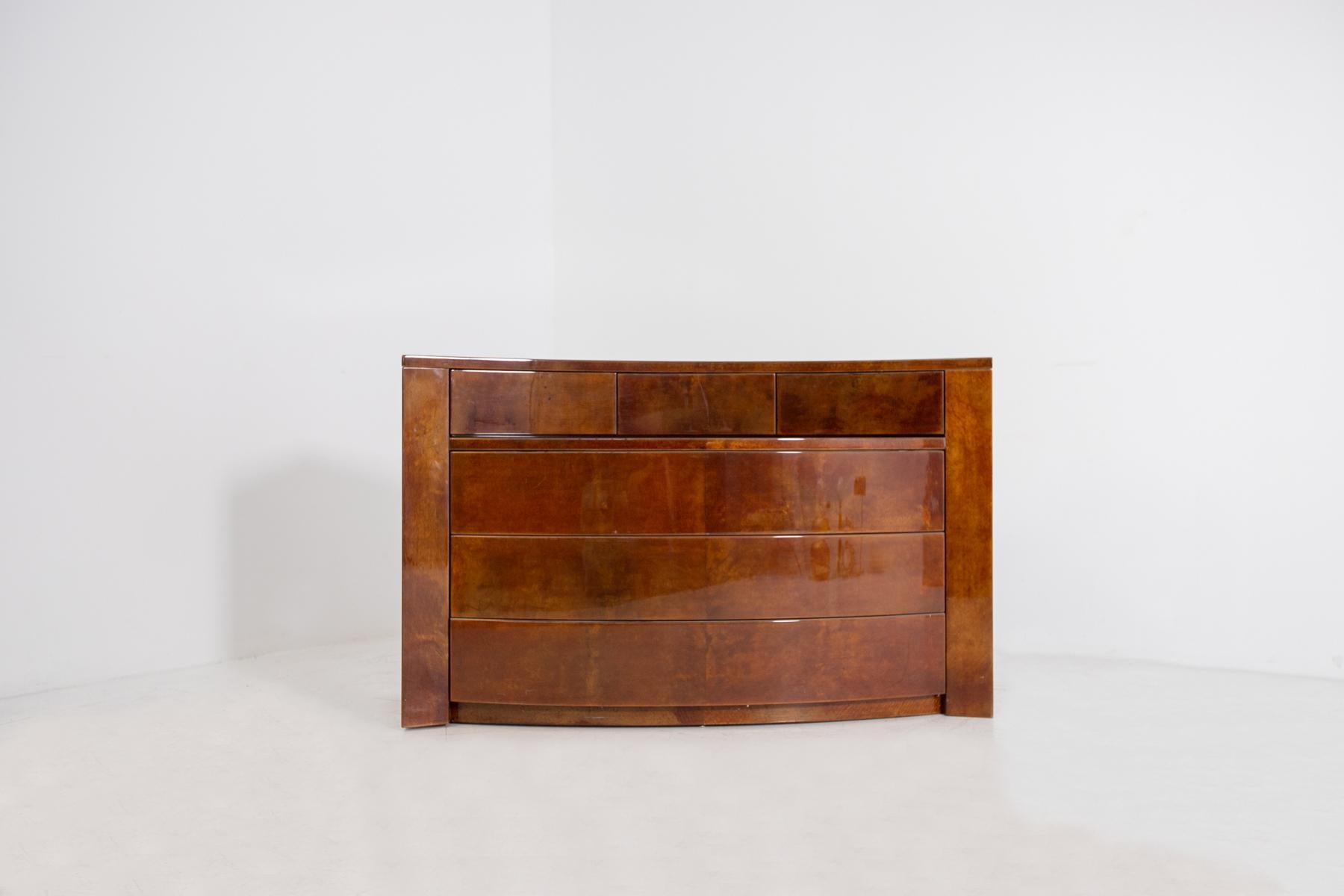 Elegant and valuable chest of drawers designed by Giorgio Tura in the 80's. The chest of drawers is also available as a small sideboard with drawers.
The dresser is finished in a precious parchment brown color with elegant and very beautiful