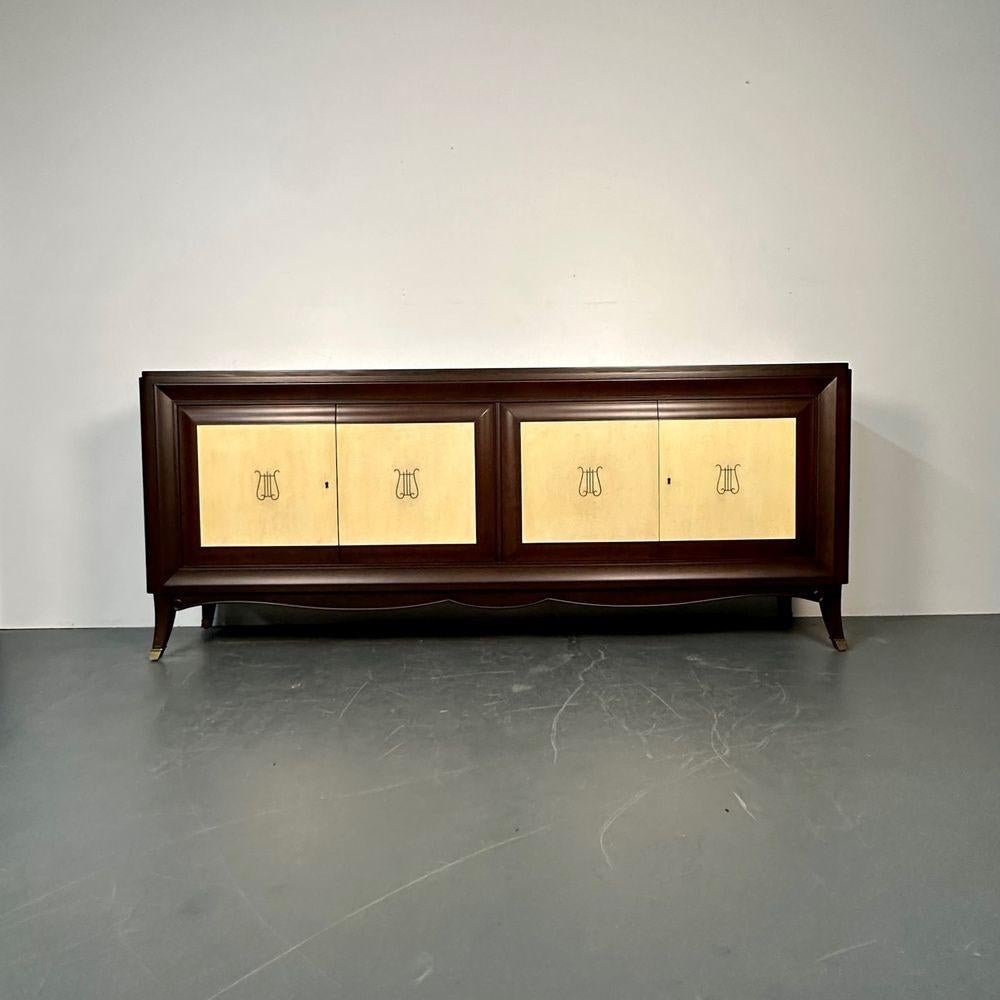 Italian Mid-Century Sideboard / Credenza / Cabinet, Parchment, Mahogany, 1950s

Timeless Italian mahogany and parchment sideboard having four doors with inset parchment panels each having a lyre form inlay. This large and impressive Sideboard or
