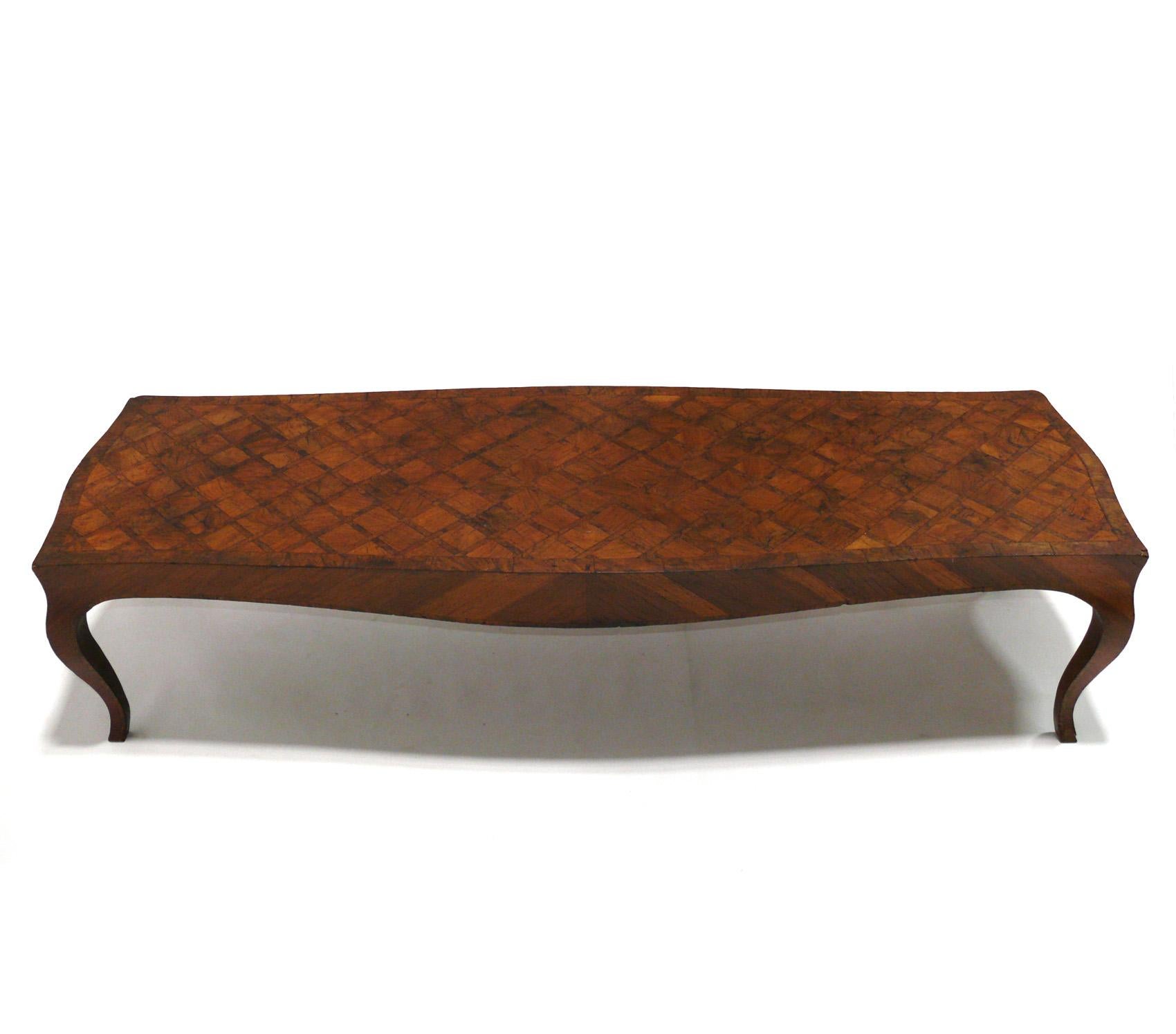 Italian Parquetry Coffee Table, Italy, circa 1950s. This table is currently being refinished and will look amazing when it is completed. It measures an impressive 72.25