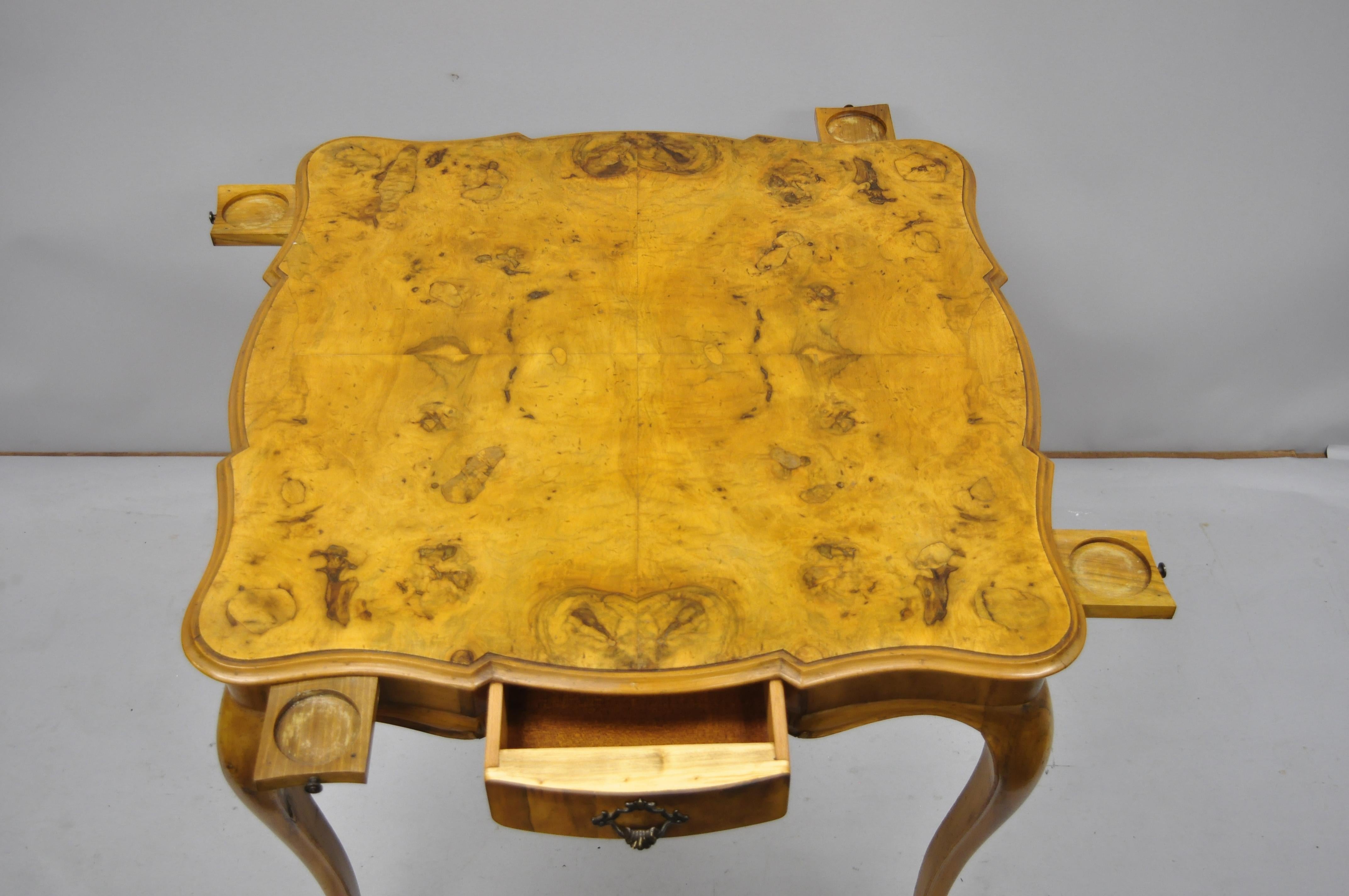 Italian patchwork burl olivewood French Louis XV style card game table. Item features 4 pull-out / pull-out cup holders, beautiful burl olivewood, patchwork top, 1 dovetailed drawer, cabriole legs, great style and form, circa mid-20th century.