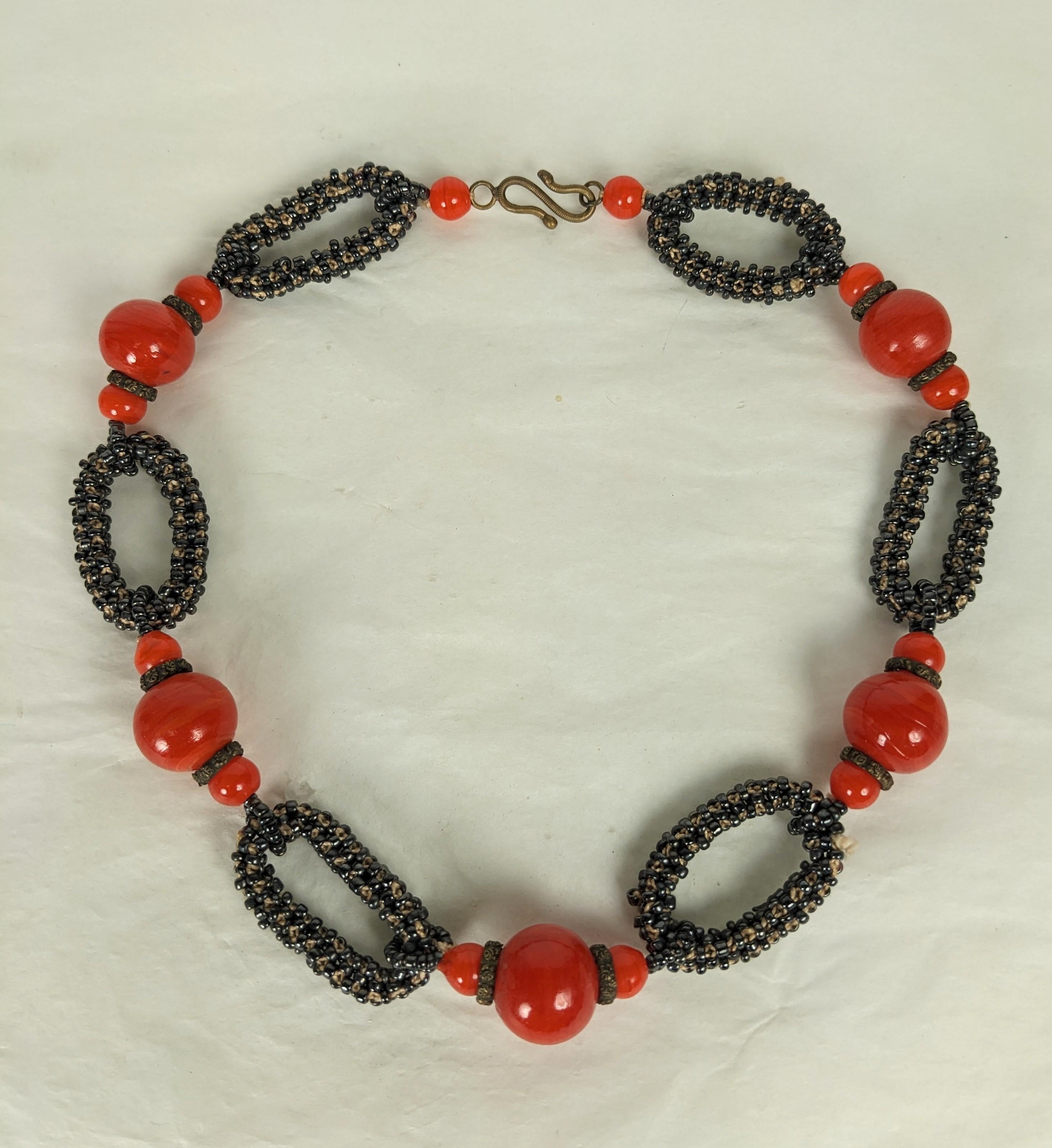 Elegant, handmade Italian Pate de Verre Seed Bead Chain from the 1940's. Chain links of hand of crochet charcoal seed beads are spaced with orangey red glass beads. Engraved brass spacers and fittings. 1940's Italy. 21