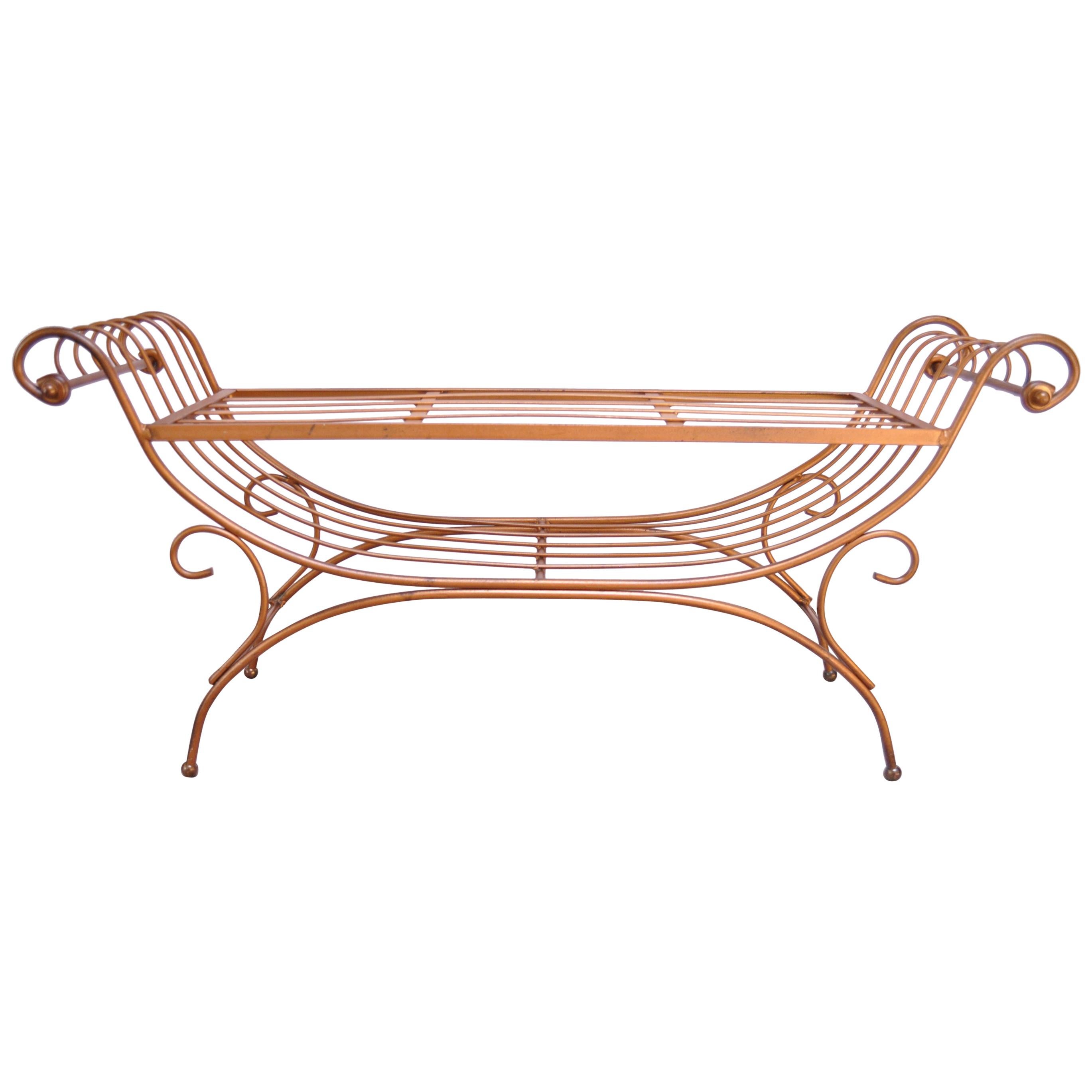 This circa 1950s Italian bench is composed of a patinated brass frame whose design resembles a lyre's form with strings that branch out into curved arms. There are minor spots of tarnish to the brass, as shown. The original cushion has been well