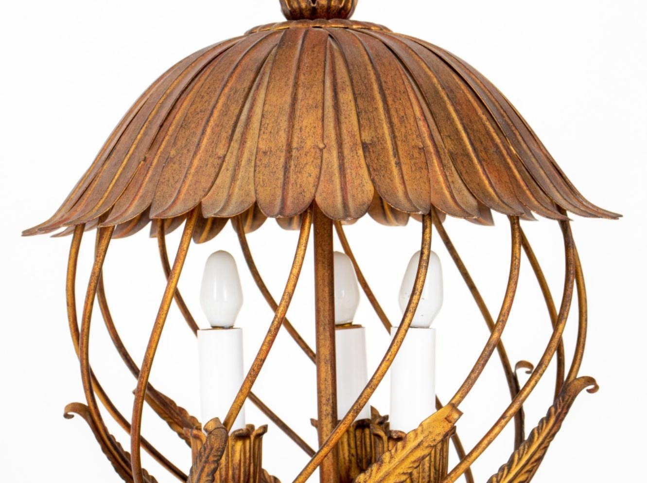 Italian patinated metal rustic style openwork lantern, likely 1970s, with a leaf form bell-shaped canopy above a diagonal cage-form lantern with leaf appliques containing three candle lights, supported by a leaf form cup and pendant. 

Dealer: