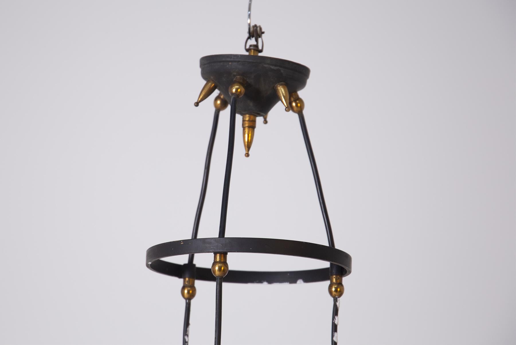 Pendant by Vistosi in colored opaline glass with 3 lights. The structure that supports the lamp holders is made of painted iron with ornamental elements in chrome-plated brass. The various connecting elements are also in brass. The three lamp