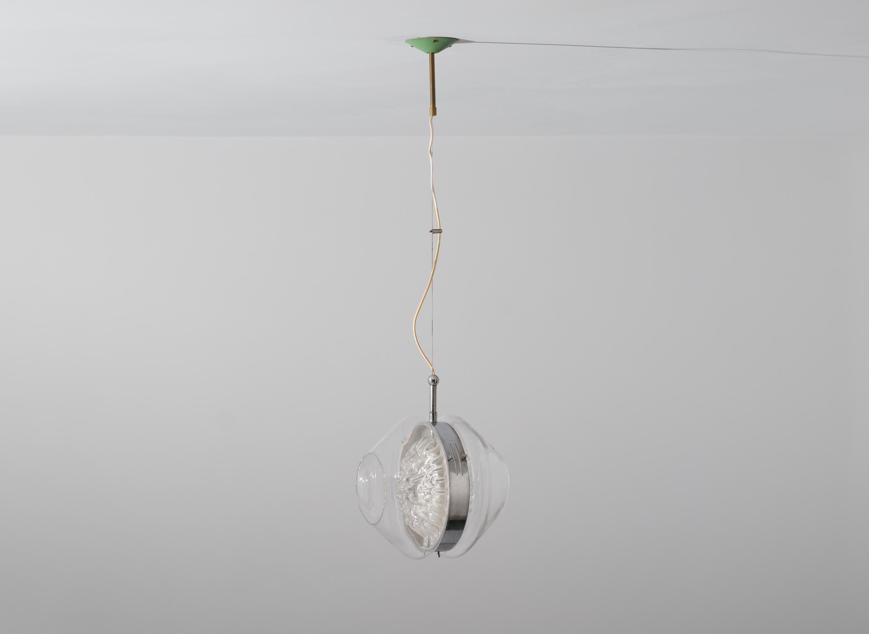 Mid-Century Modern chandelier manufactured in Italy during the 60s. 
This pendant lamp features very particular murano glass along with steel and brass parts.

Original working wire with 3 standard E14 bulbs end one E27 bulb.