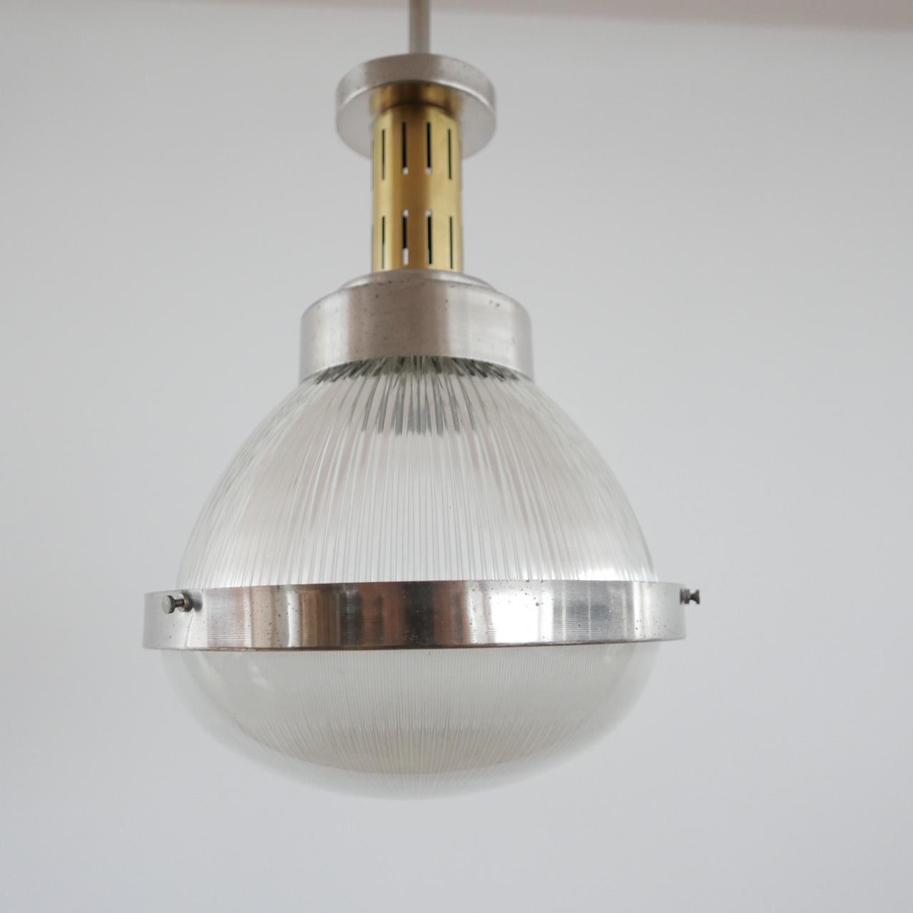 An Italian midcentury pendant light.

Attributed to Ignazio Gardella,

circa 1960s.

Nickel-plated brass, brass and pressed glass

Dimensions: Total height 90 height x 50 height (without rod) x 40 diameter in cm.

  