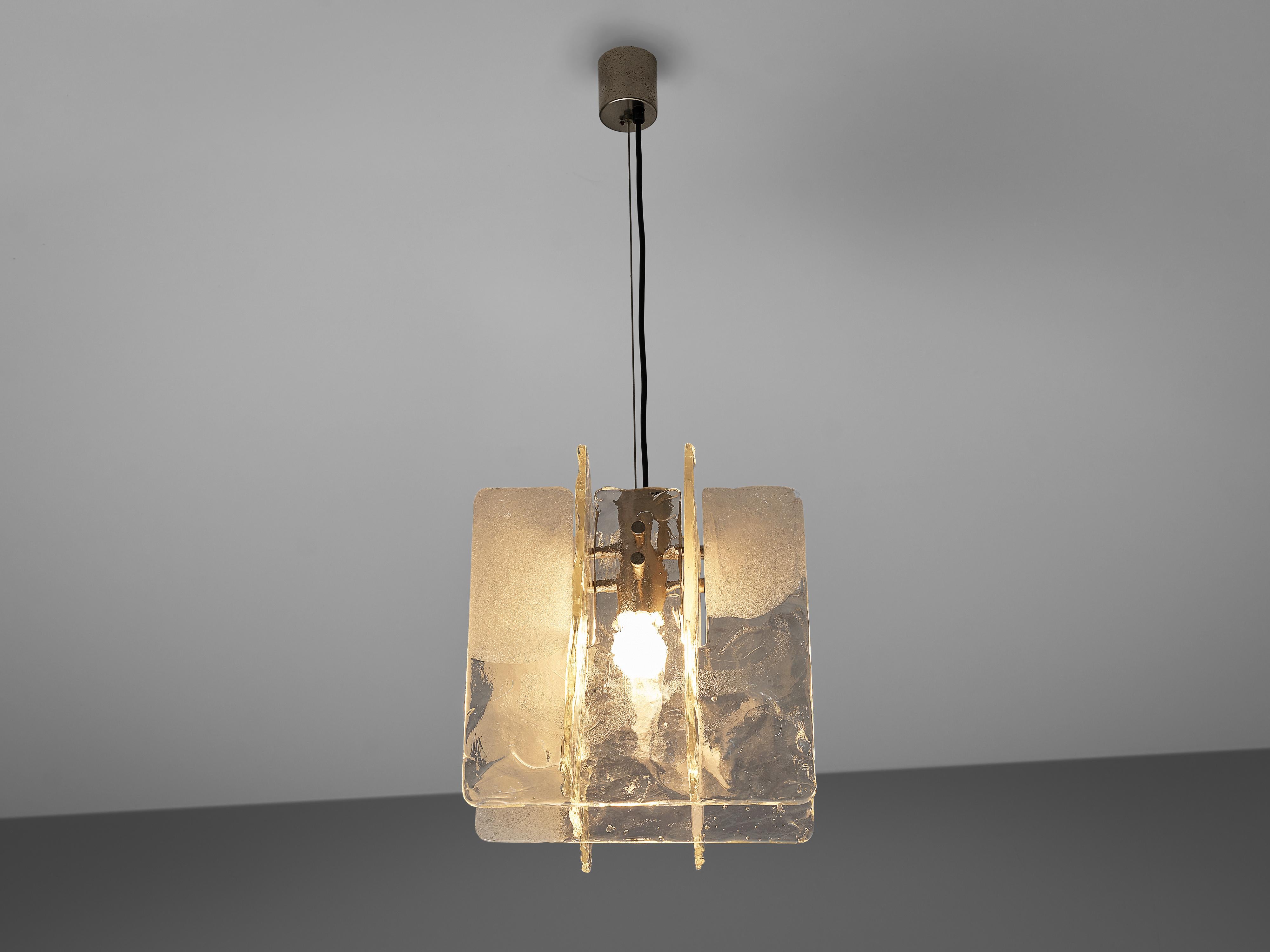 Pendant, glass, brass, Italy, 1960s

Stunning sculptural glass pendant. The lamp has an elegant feel created by its structured, yet delicate form. This is emphasized by the brass elements. The glass has a nice structure to break the light and