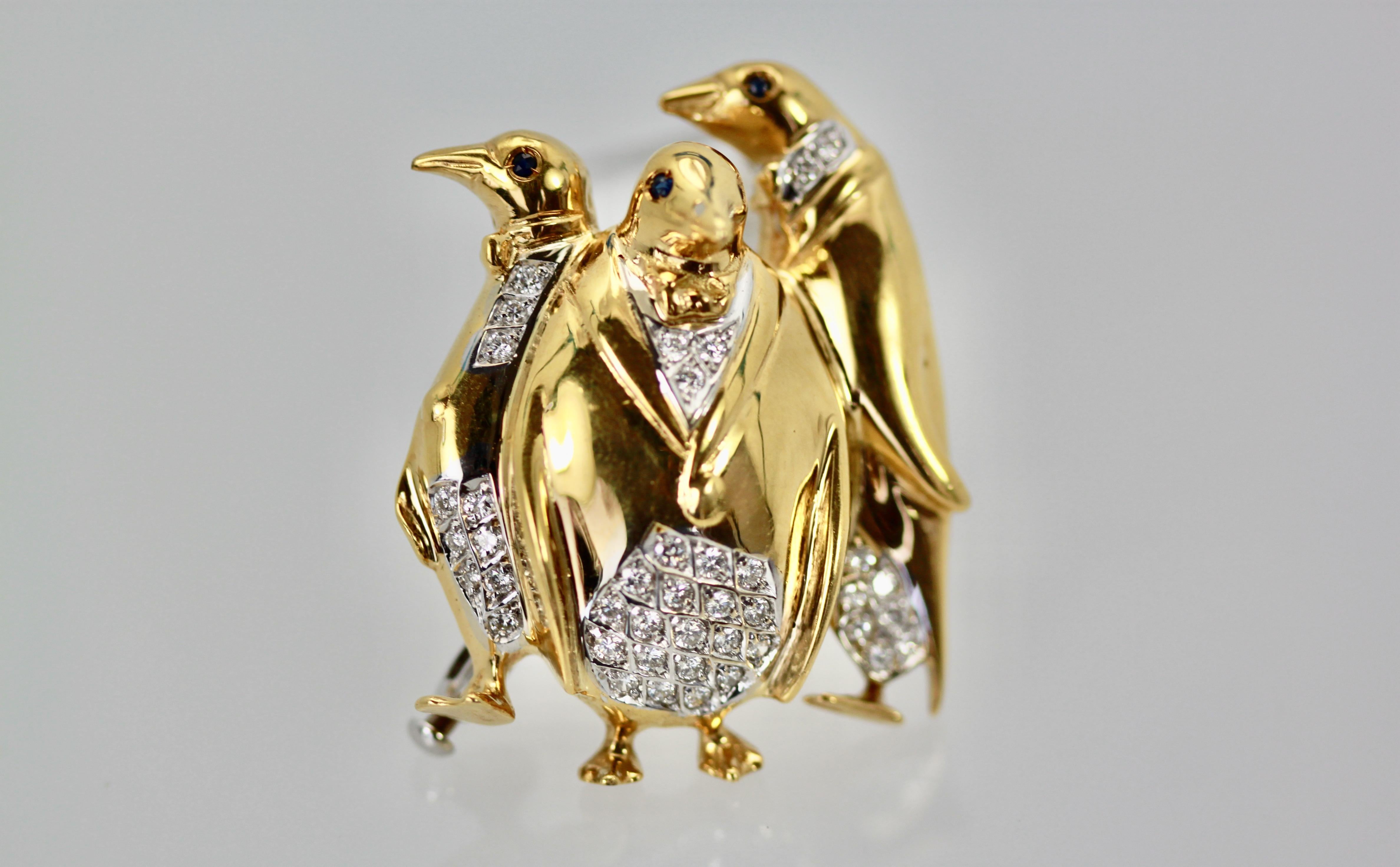 This delightful Italian Penguin brooch features 3 penguins with Diamond inserts.  It weighs 16.6 grams and measures 35cm x 28cm. Thee are 43 Diamonds grace the collar, throat and bottom of body.  Four Ruby eyes and a double clasp. This is a perfect