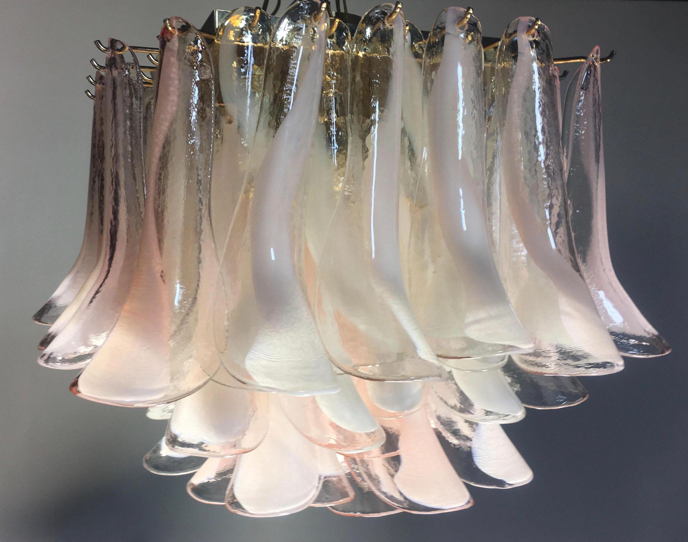 Spectacular ceiling lamp with 76 Murano glasses. The glasses have two different colors, half are transparent with white spots, half are pink with white spots. Elegant lighting object.
Period: late 20th century
Dimensions: 19.68 inches (50 cm)