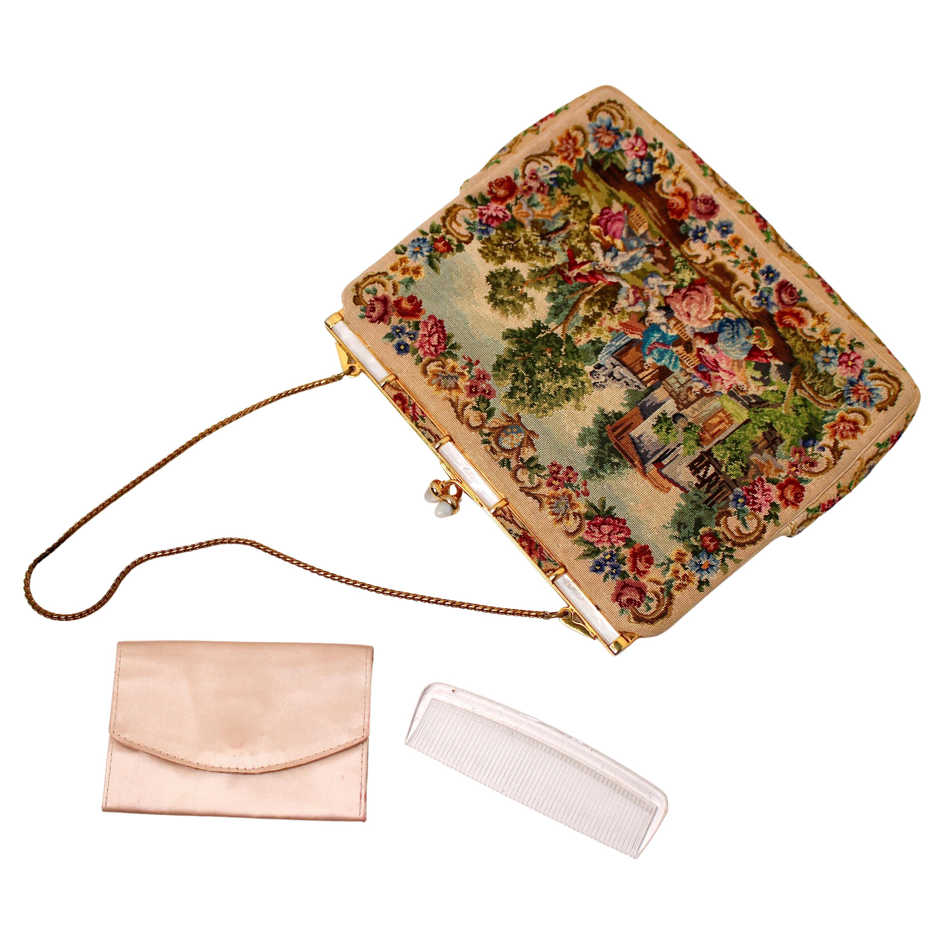 This beautiful Italian Petit Point Evening Bag from circa 1930s exemplifies timeless elegance and craftsmanship. Featuring intricate Petit Point embroidery, the bag showcases delicate floral motifs, meticulously crafted to reflect the luxurious