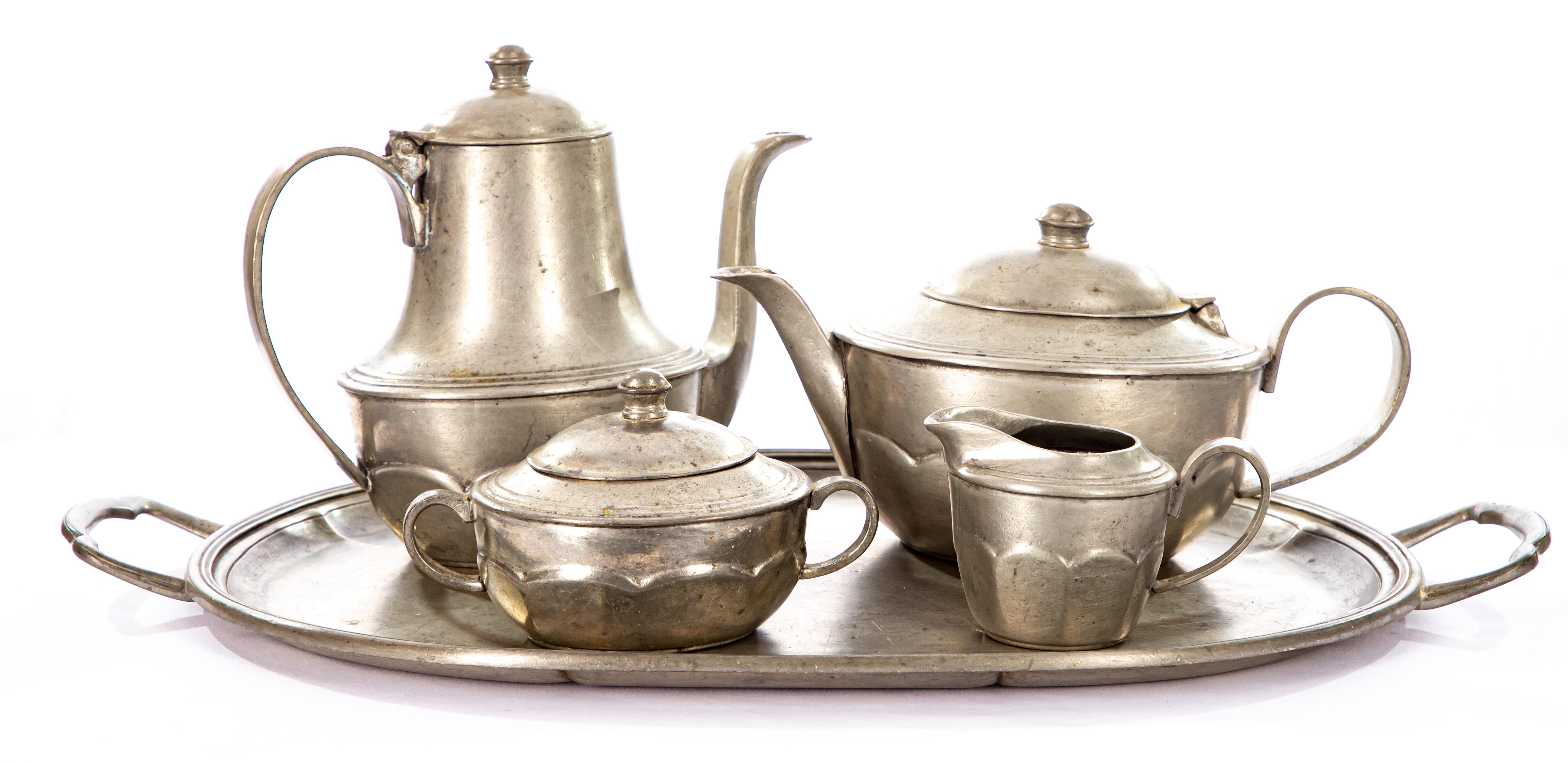 Offering this beautiful aged Italian pewter tea service. The service comes with a tray, creamer, sugar, short kettle and a tall kettle.