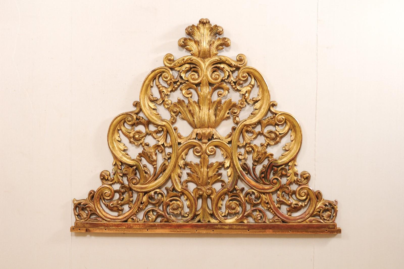 An Italian carved wood architectural fragment, which would make a great headboard for a bed, from the mid-20th century. This vintage wall decoration from Italy features beautifully pierced-wood carved body in a scroll and acanthus leaf motif. This