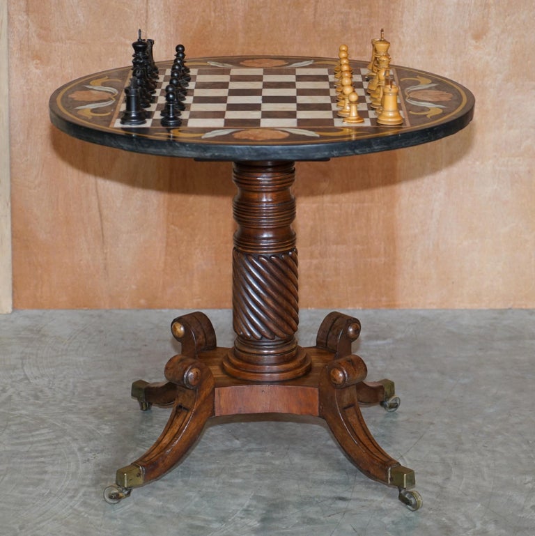 We are delighted to offer for sale this absolutely exquisite antique Pietra Dura Italian Marble chess table with Regency Mahogany circa 1815 base and antique Staunton box wood chess set

This is the most exceptional chess table I have ever seen,