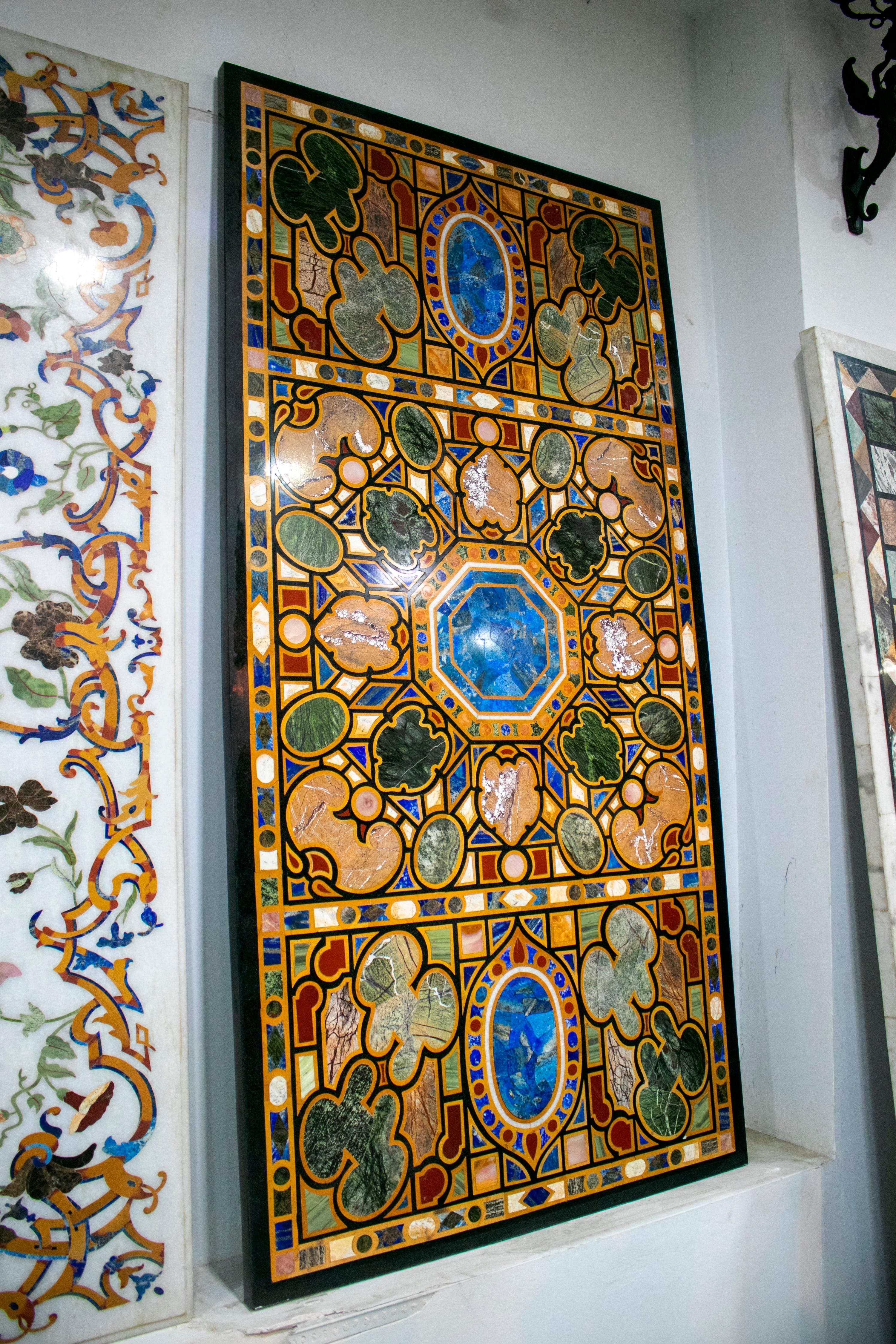Italian pietra dura stone inlay rectangular 8-seat dining tablet top with geometric decorations hand crafted with blue lapis lazules and different semiprecious stones and marbles.