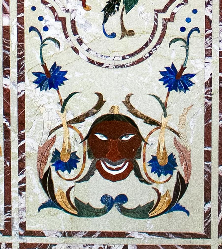 Italian pietra dura rectangular 6-seater dining tablet top decorated with flowers and faces on the sides handcrafted from blue lapis lazuli and other semiprecious stones and marbles.