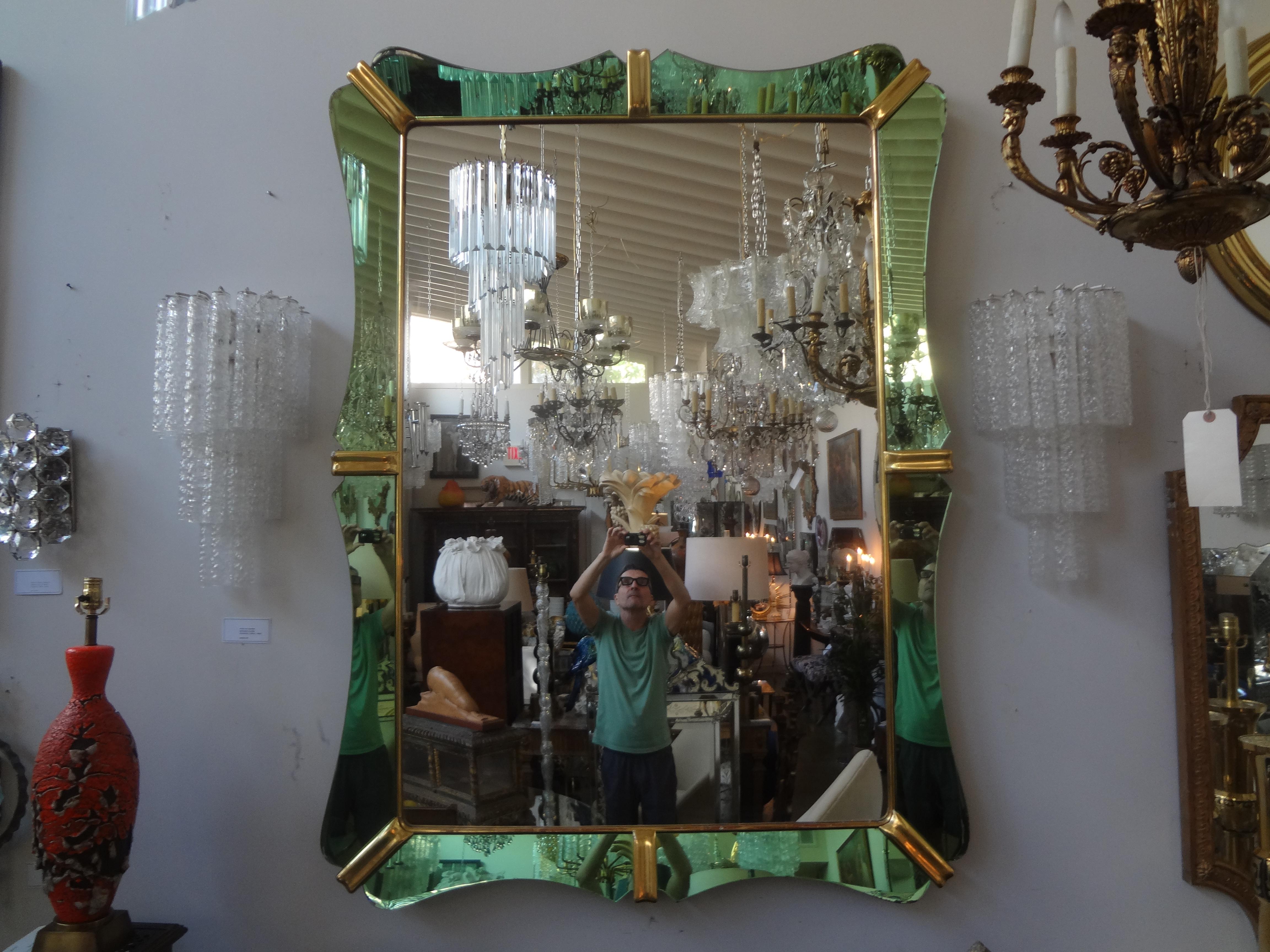 Italian Pietro Chiesa for Fontana Arte Attributed mirror.
This monumental Italian mirror with most unusual green glass perimeter trimmed in giltwood accents.
Our stunning Italian Art Deco mirror can be displayed horizontally or vertically.