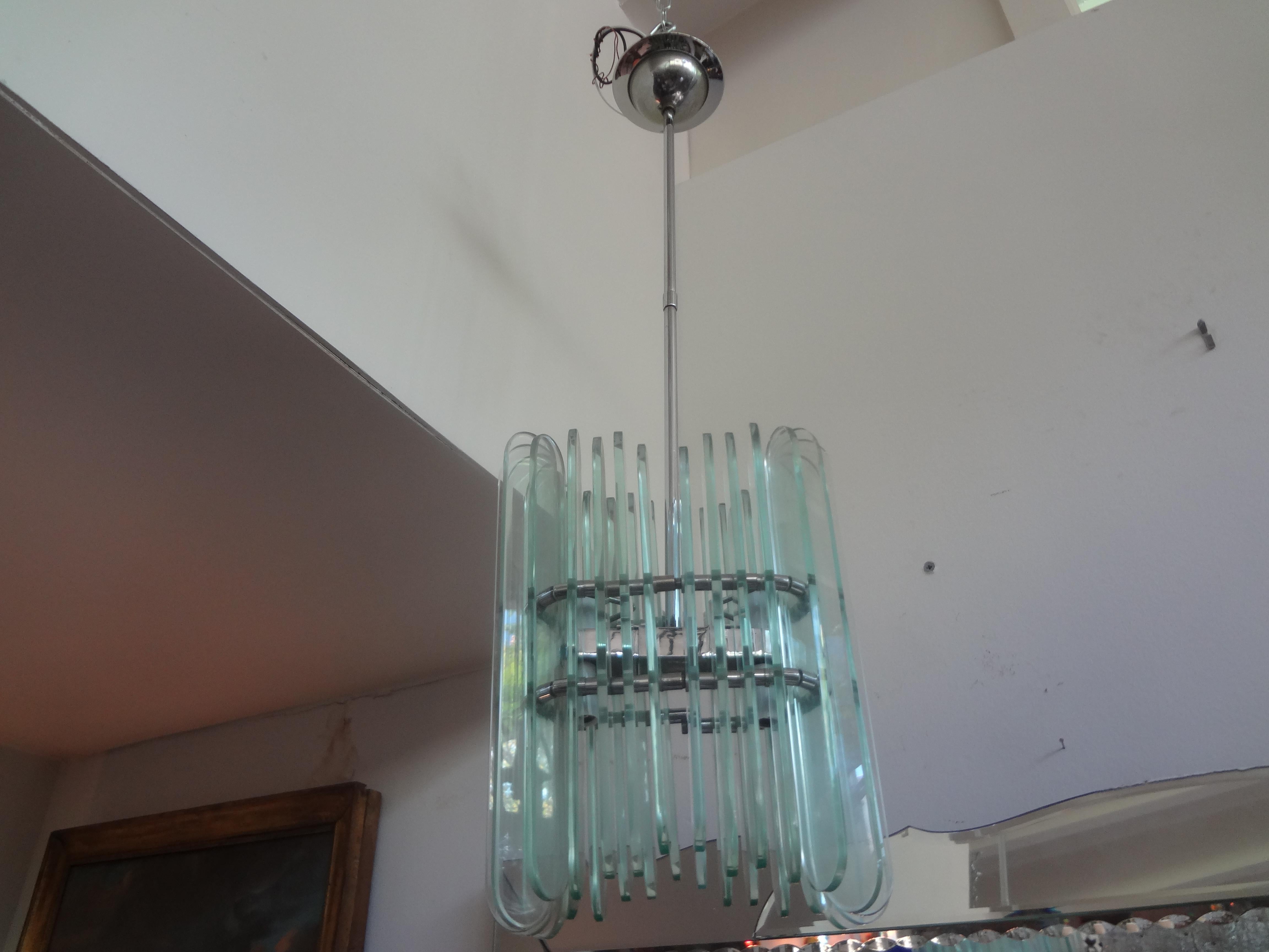 Italian Pietro Chiesa for Fontana Arte style pendant or lantern. This stunning italian chandelier or lantern is comprised of sheets of glass on a chrome frame and has been newly wired to U.S. Specifications. Height can be adjusted by adding a larger