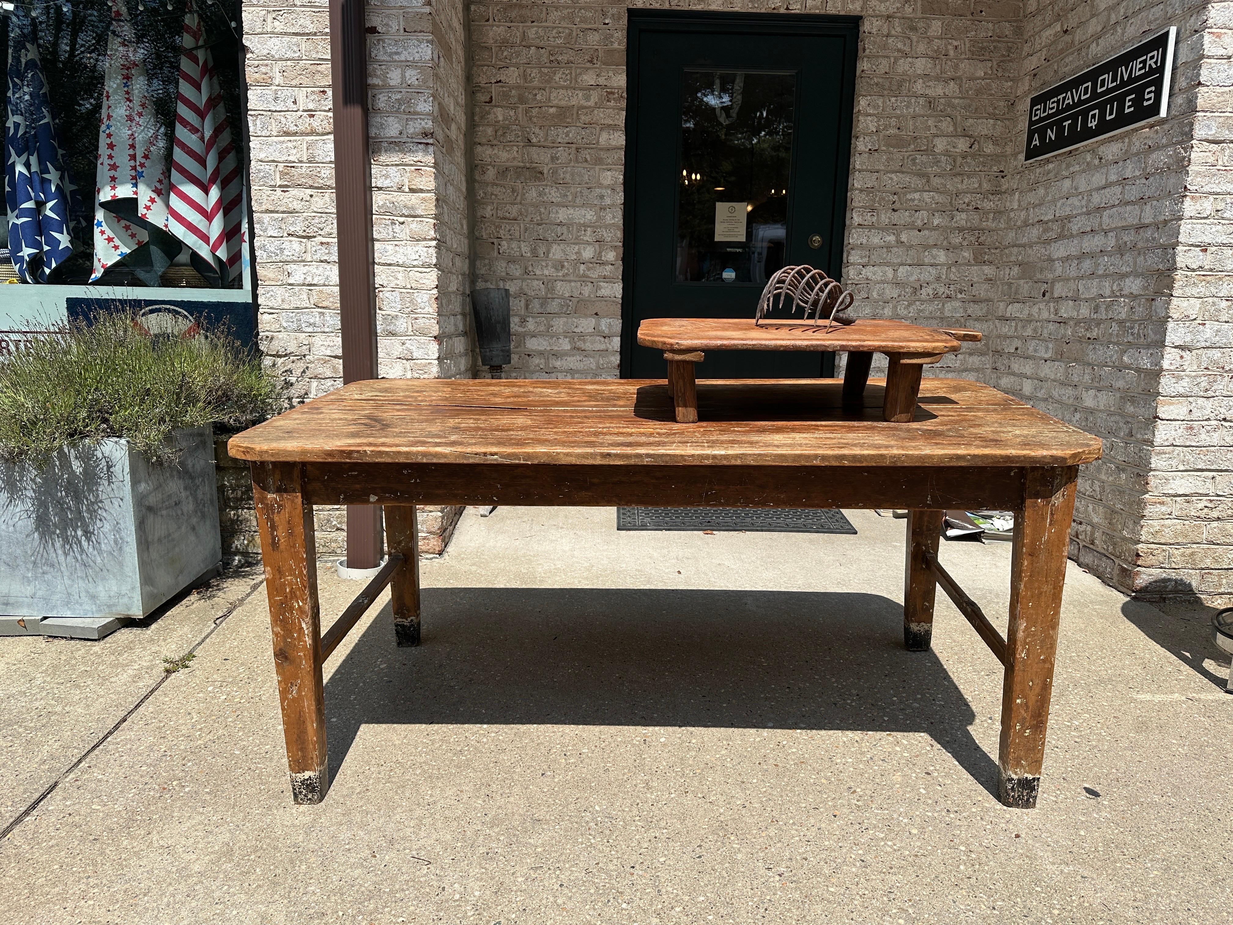 This wonderful pine farm table has so many lovely details such as painted feet and exceptional distress throughout.  Perfect for a table or desk.