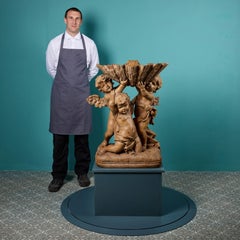 An Italian Hand Carved Pine Putti Statue