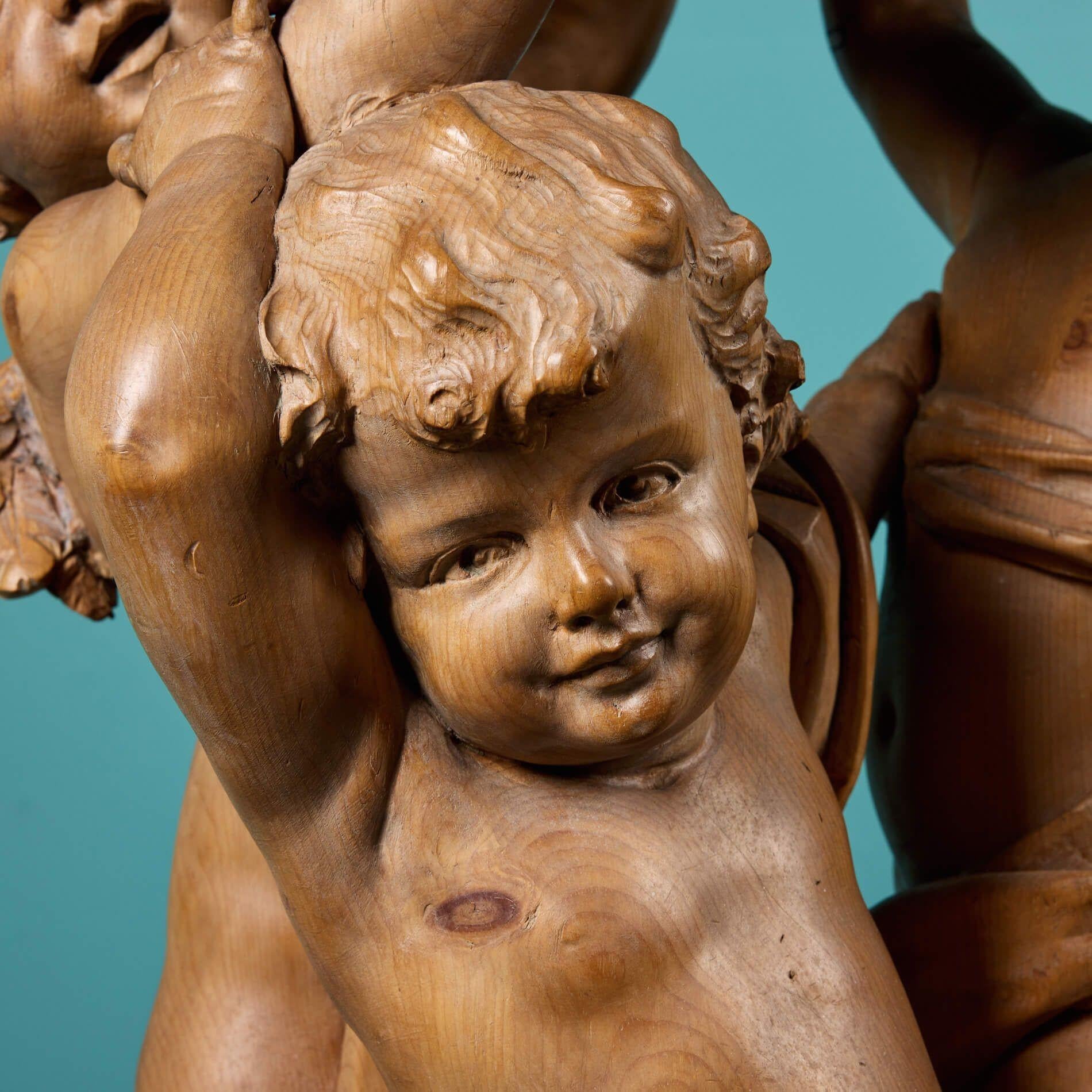 Hand-Carved An Italian Hand Carved Pine Putti Statue For Sale