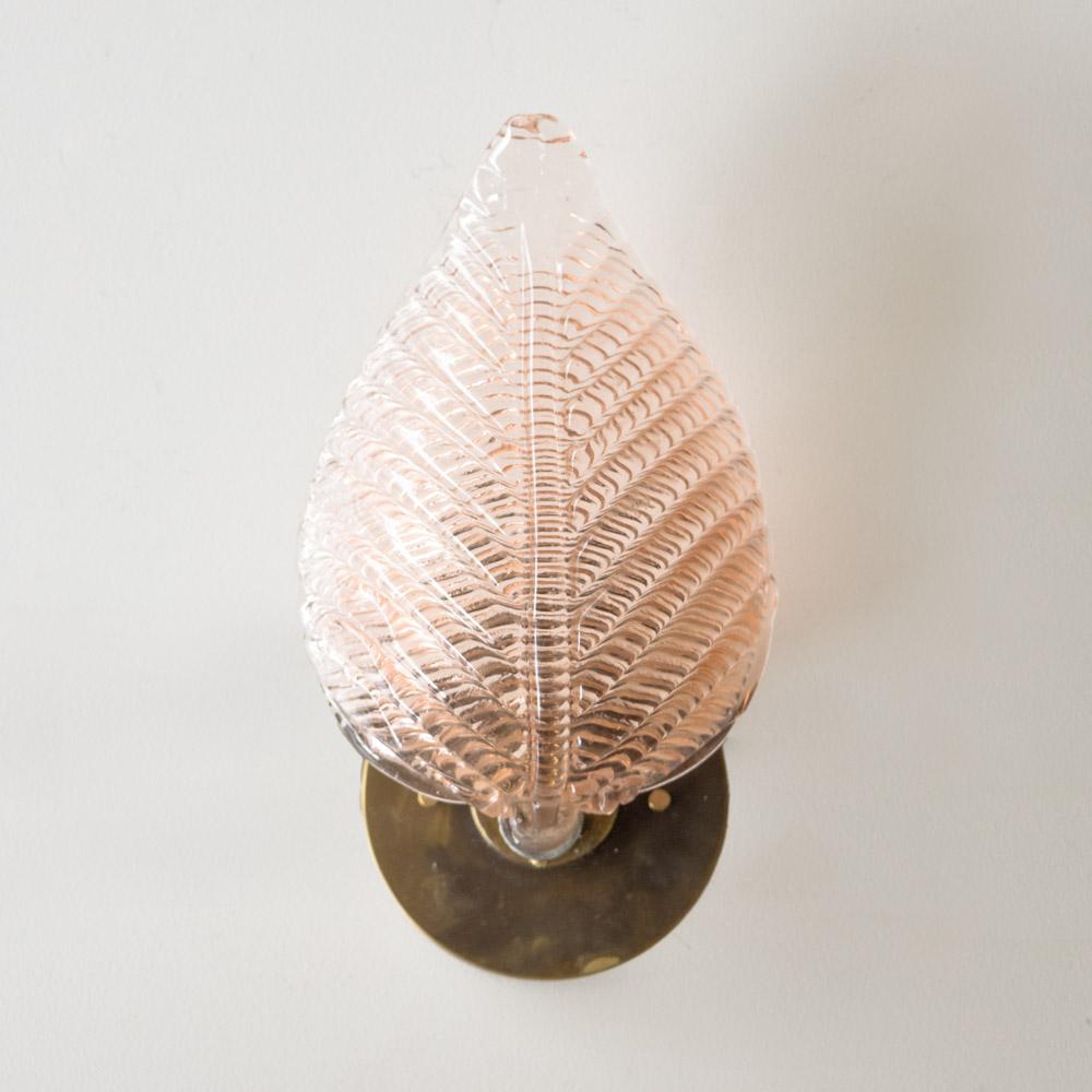 Beautiful blown glass sconce from Italy, 1950s. Pink etched glass in the shape of a leaf with brass hardware. Newly re-wired with single socket and new circular brass backplate. Takes one E12 base bulb, 25 W or higher using LED. 

.