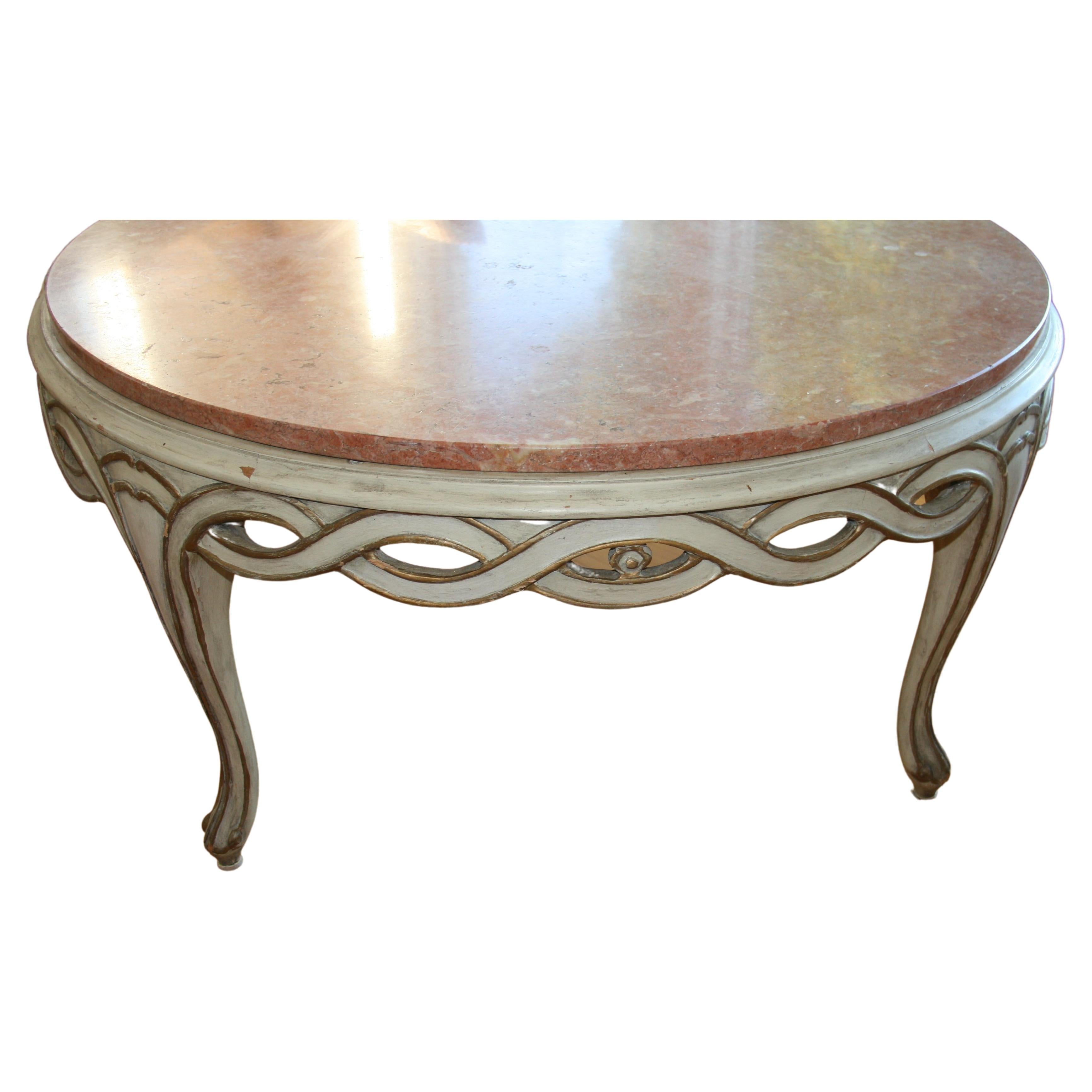 1381 Italian pink marble top coffee table with carved wood braded surround.