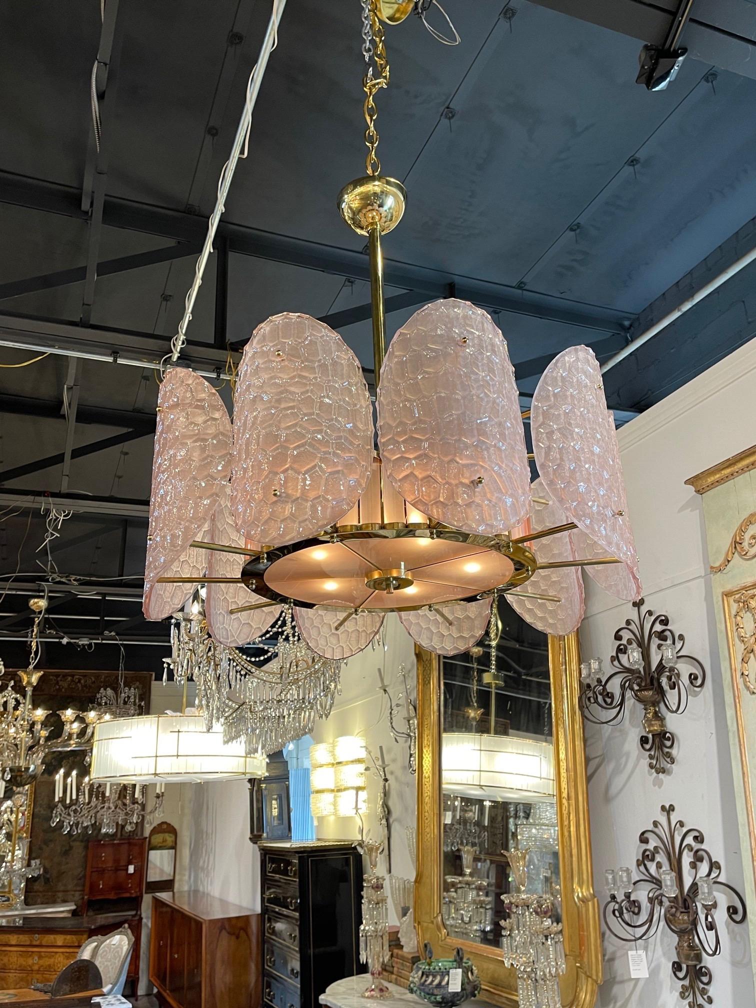 Exquisite Italian pink Murano glass and brass disc chandelier. The textured glass on the discs is a gorgeous pale pink. And the inside has is also a pretty pink in a decorative brass base. Stunning!