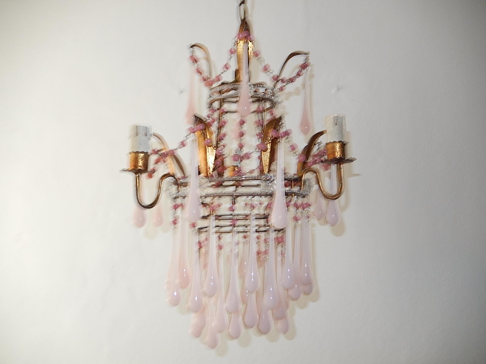 Housing 3 lights, will be rewired with certified UL US sockets for the USA and certified sockets for other countries and ready to hang. Gilt metal body with tiny beading and florets. Gilt metal with swags of pink opaline Murano beads and drops.