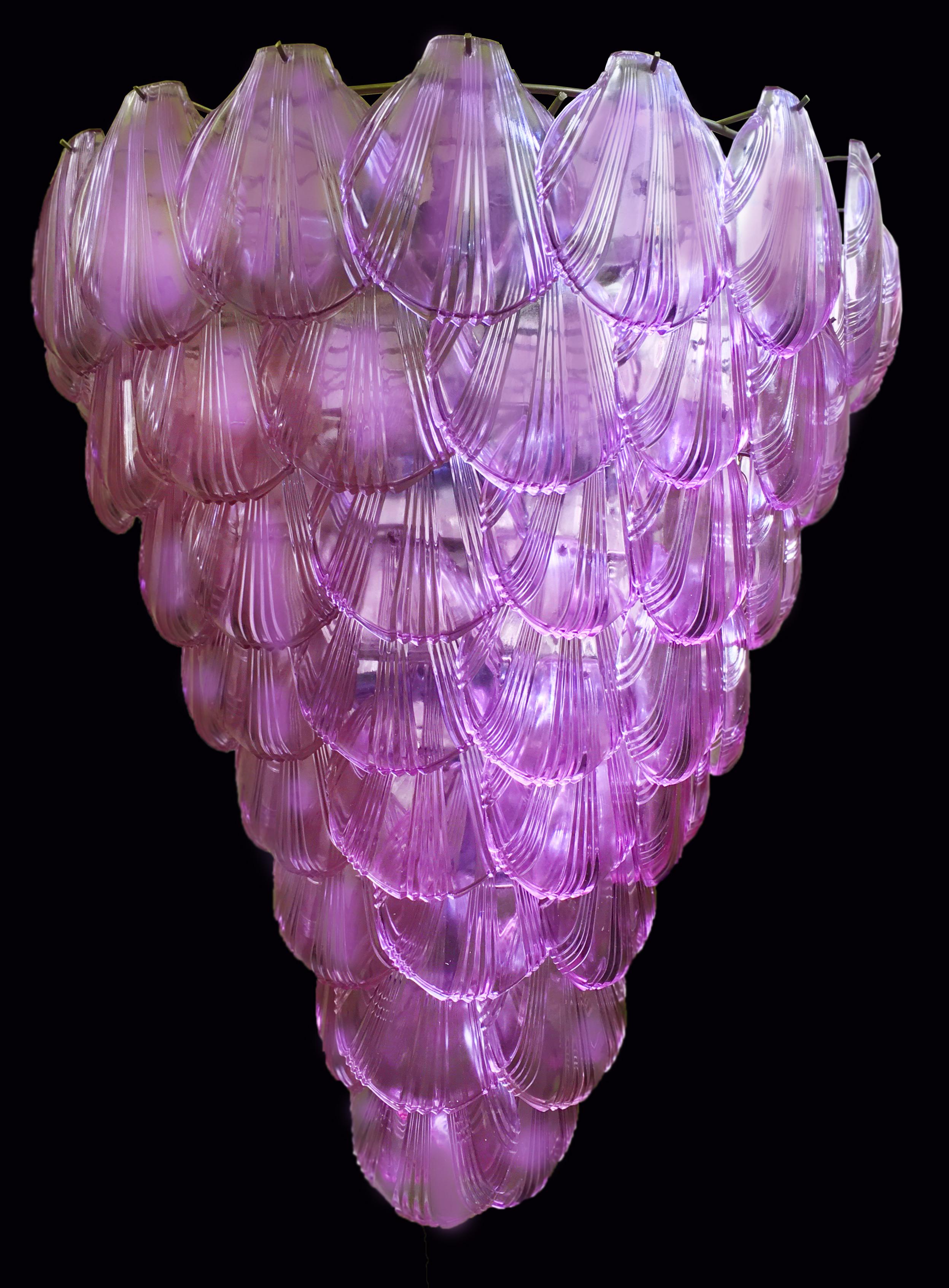 Beautiful and huge Italian Murano chandelier composed of shaped like a shell glasses that give a very elegant look. The glasses of this chandelier are real works of art, the weight of this chandelier is 50 kg.
         