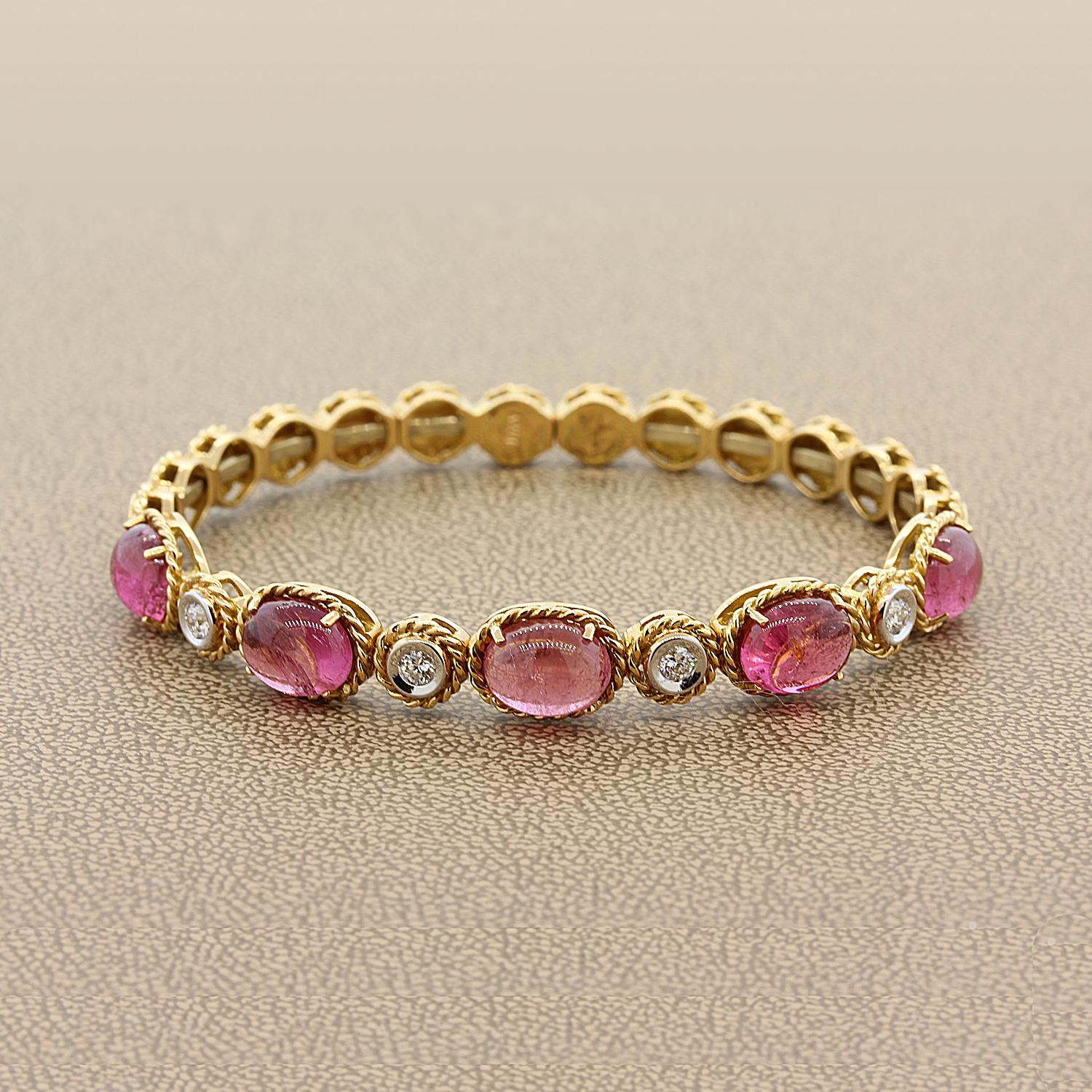 An Italian piece featuring 10.15 carats of smooth pink cabochon tourmaline and 0.32 carats of round cut diamonds. The gems are set in an 18K gold stretch mounting allowing it to fit most wrists. The back of the bracelet is open.

