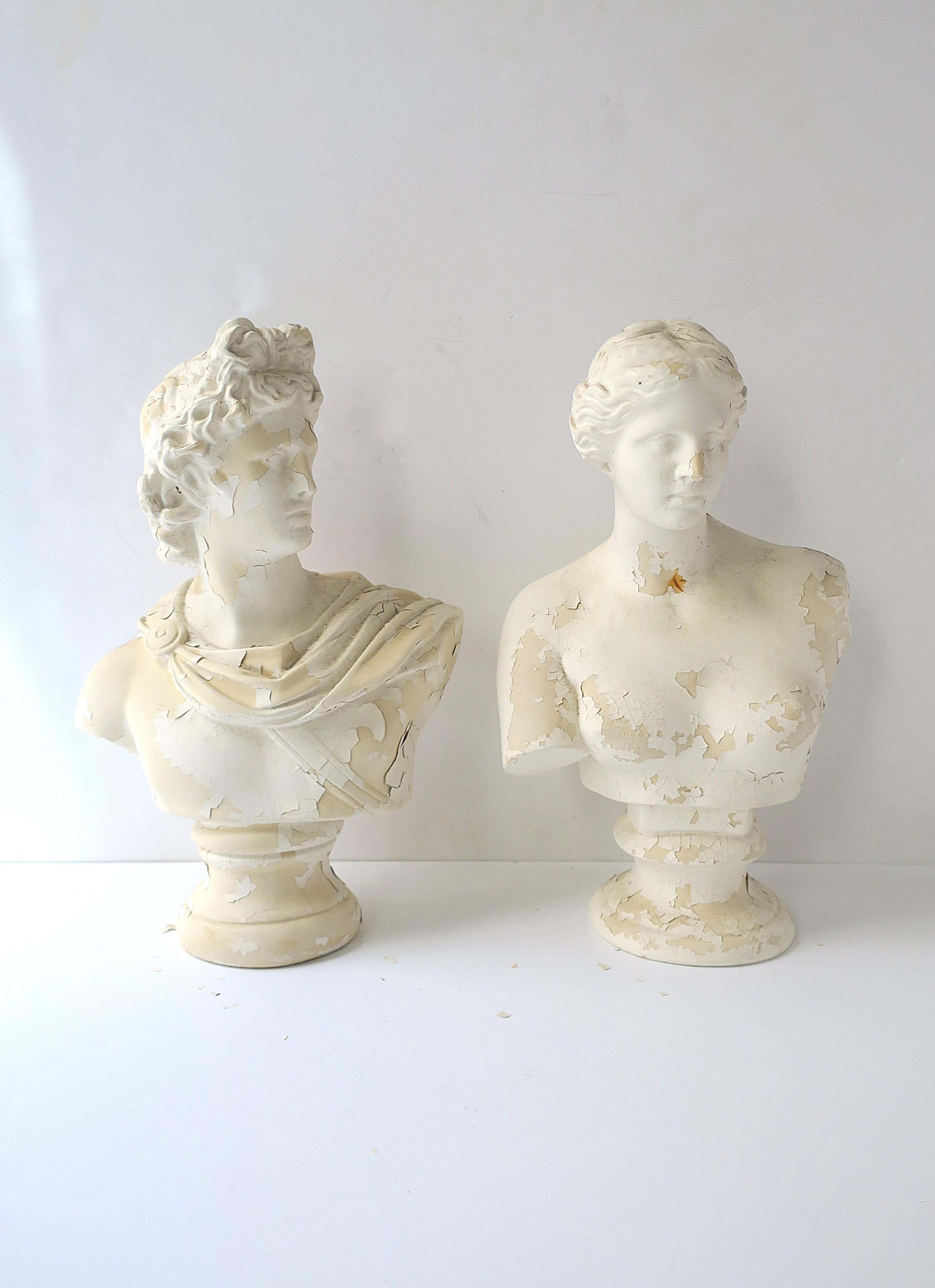 A substantial and relatively large pair/set of Italian male and female cast plaster busts, in the Greco-Roman style, circa early to mid-20th century, Italy. Busts, Apollo and Diana, God and Goddess, are in the Greco-Roman style, reproductions of the