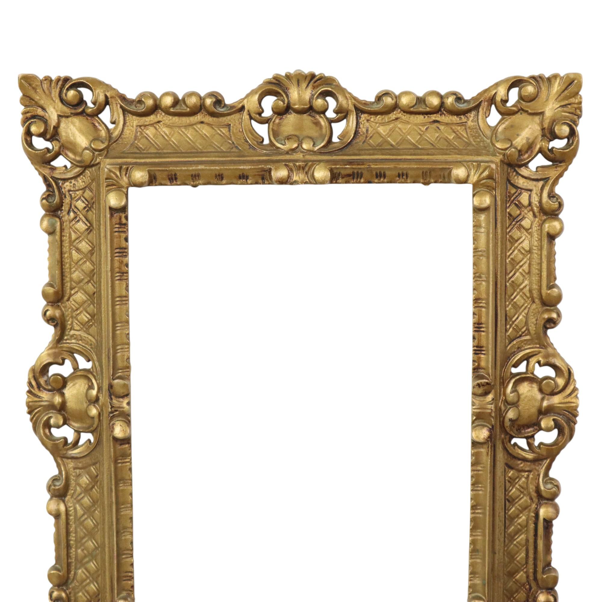 Italian gold-colored frame made of hard plastic, completely in the classic rococo style, Italy, second half of the 20th century, marked on the back with a logo with Mod Dep, which means nothing more than 'registered model'.

In good, fully complete