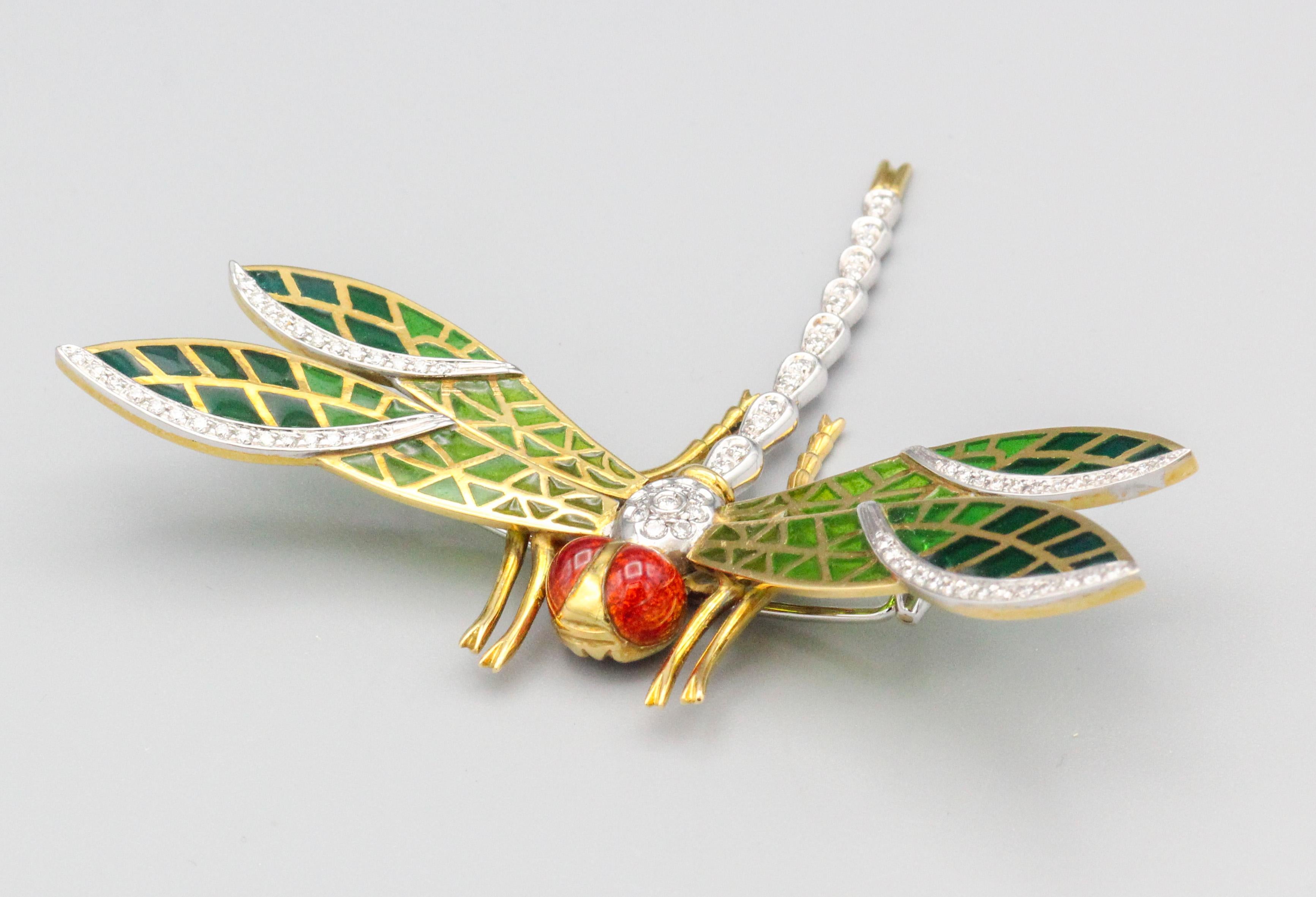 Step into a world of exquisite elegance with our Italian Plique-A-Jour Enamel Diamond 18k Gold Dragonfly Brooch. Crafted with meticulous attention to detail, this stunning piece showcases the delicate beauty of nature in the form of a captivating