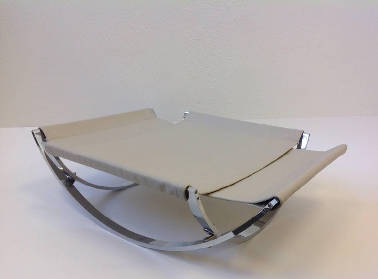 Italian Polish Stainless Steel and Leather Lounge Chair and Ottoman at