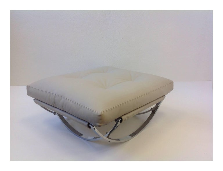 Italian Polish Stainless Steel and Leather Lounge Chair and Ottoman at