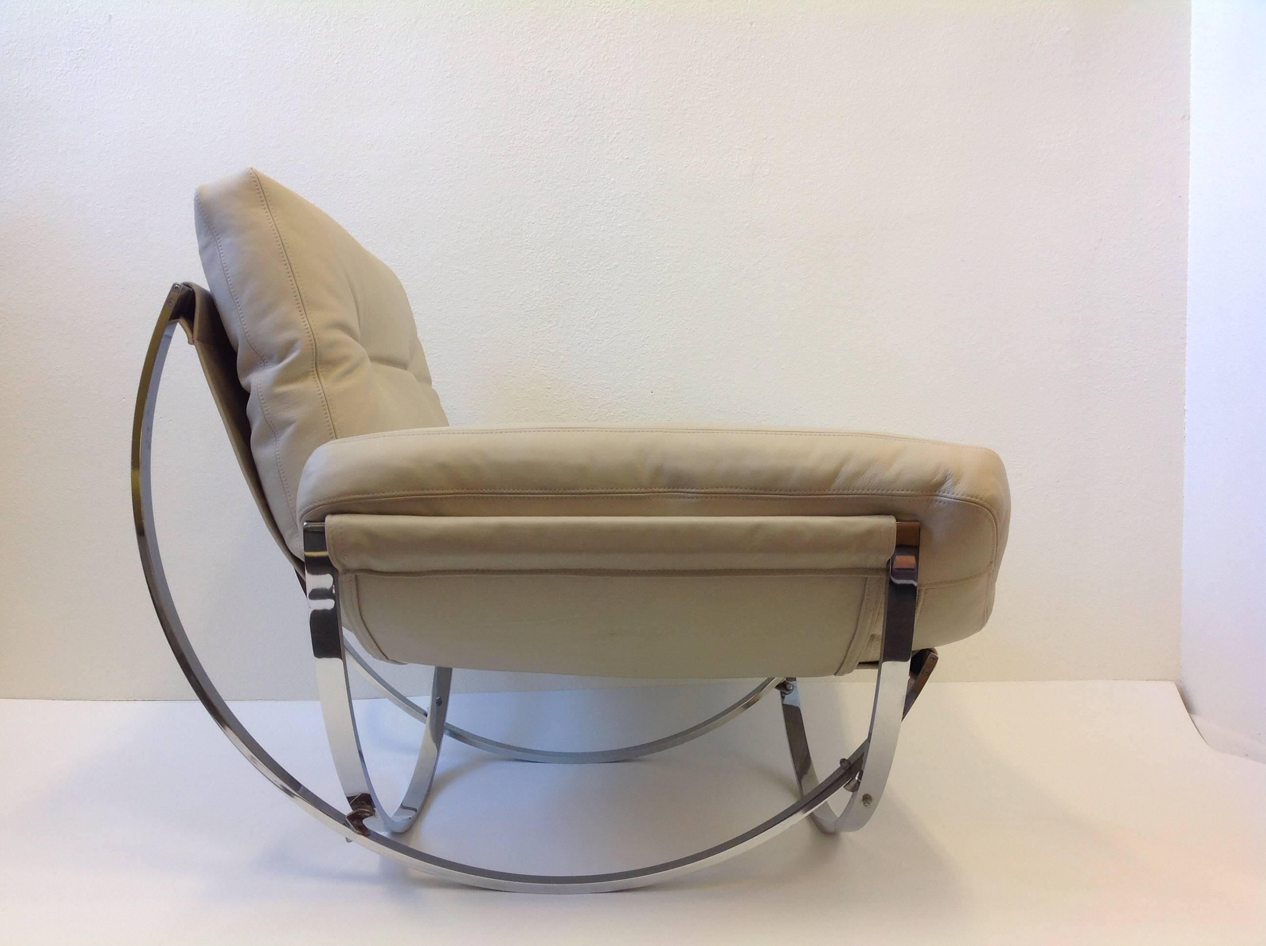 A amazing 1970s Italian lounge chair and ottoman by Stendig. The chair is constructed of solid polish stainless steel and reupholstered in a soft off white leather.  By Leonart Bender for Charlton Co.
Dimensions:
Chair 35