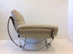 Italian Polish Stainless Steel and Leather Lounge Chair and Ottoman